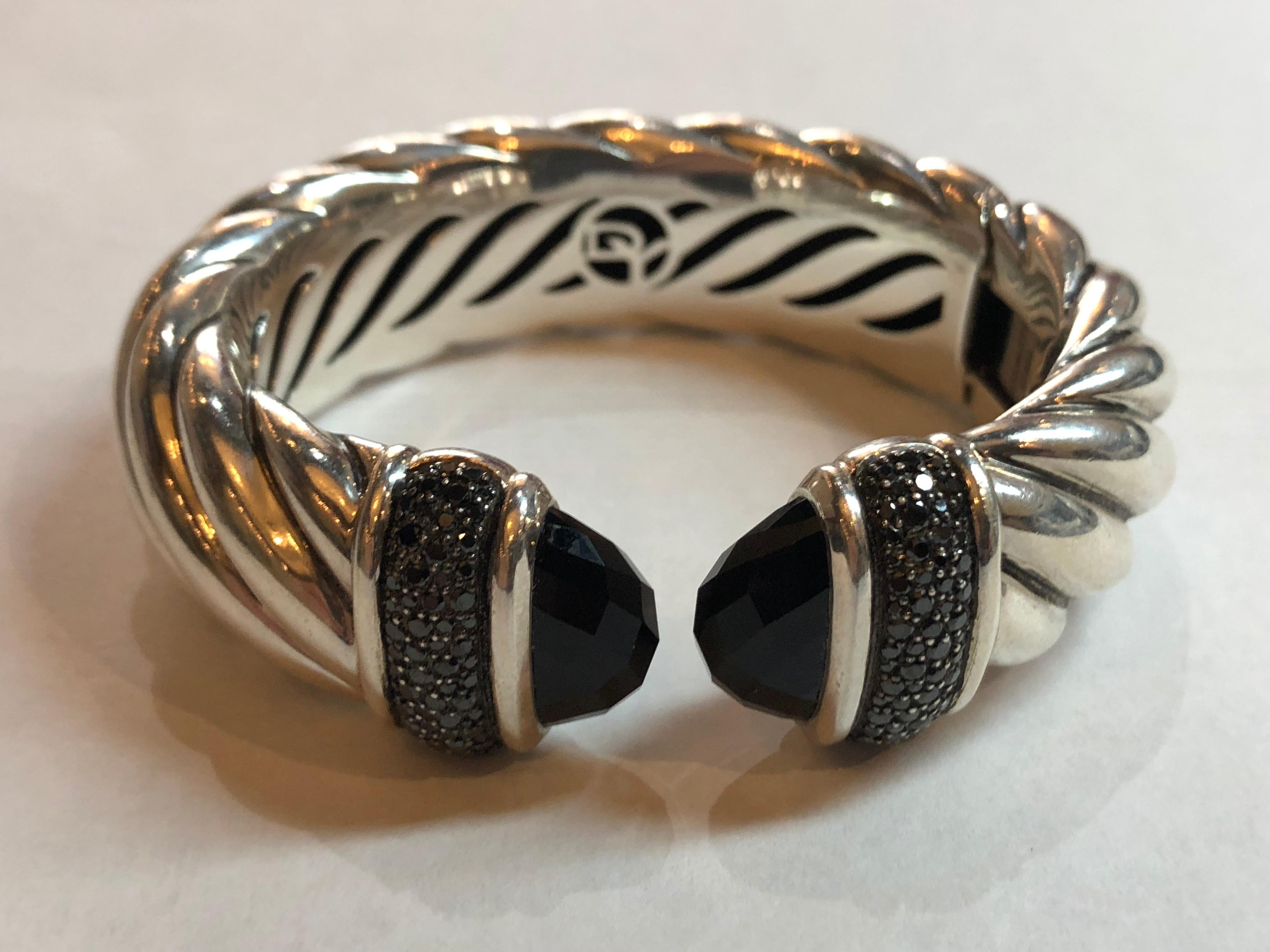 David Yurman Waverly Cuff 1.19 cts Black Diamonds and Black Onyx
Retail $3500.00
Weighs 65.4 Grams
Signed D.Y. 925
Excellent Condition
