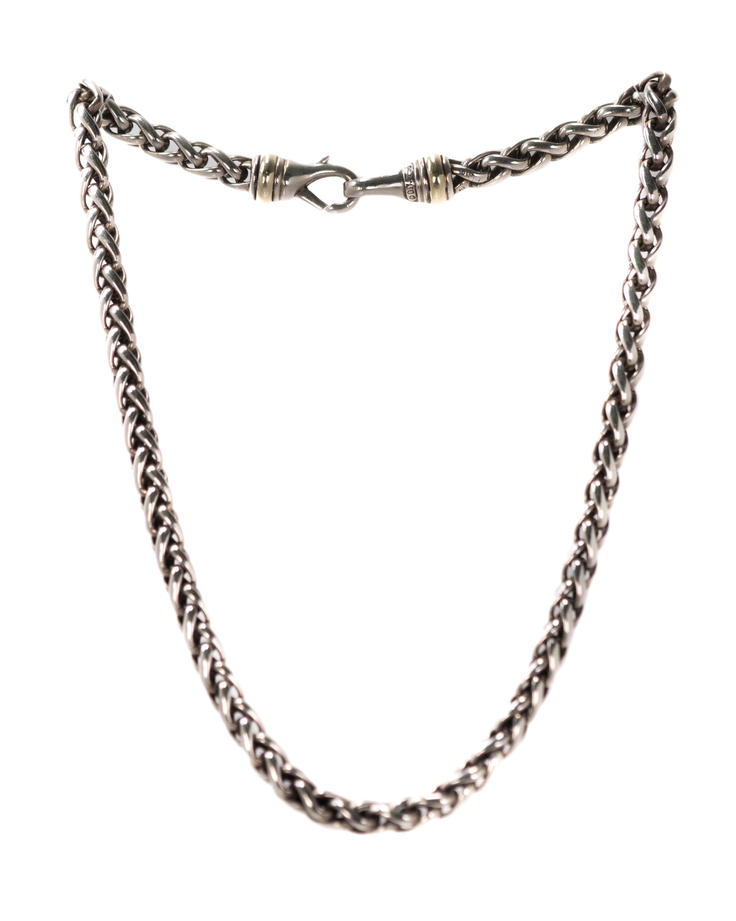 David Yurman Choker Necklace Wheat Chain - Sterling Silver, 14 Karat Yellow Gold

Features:
16 inch long choker length
Wheat chain link pattern
6 millimeters wide chain
Sterling Silver chain and clasp
14 Karat Yellow Gold band detail on each end of