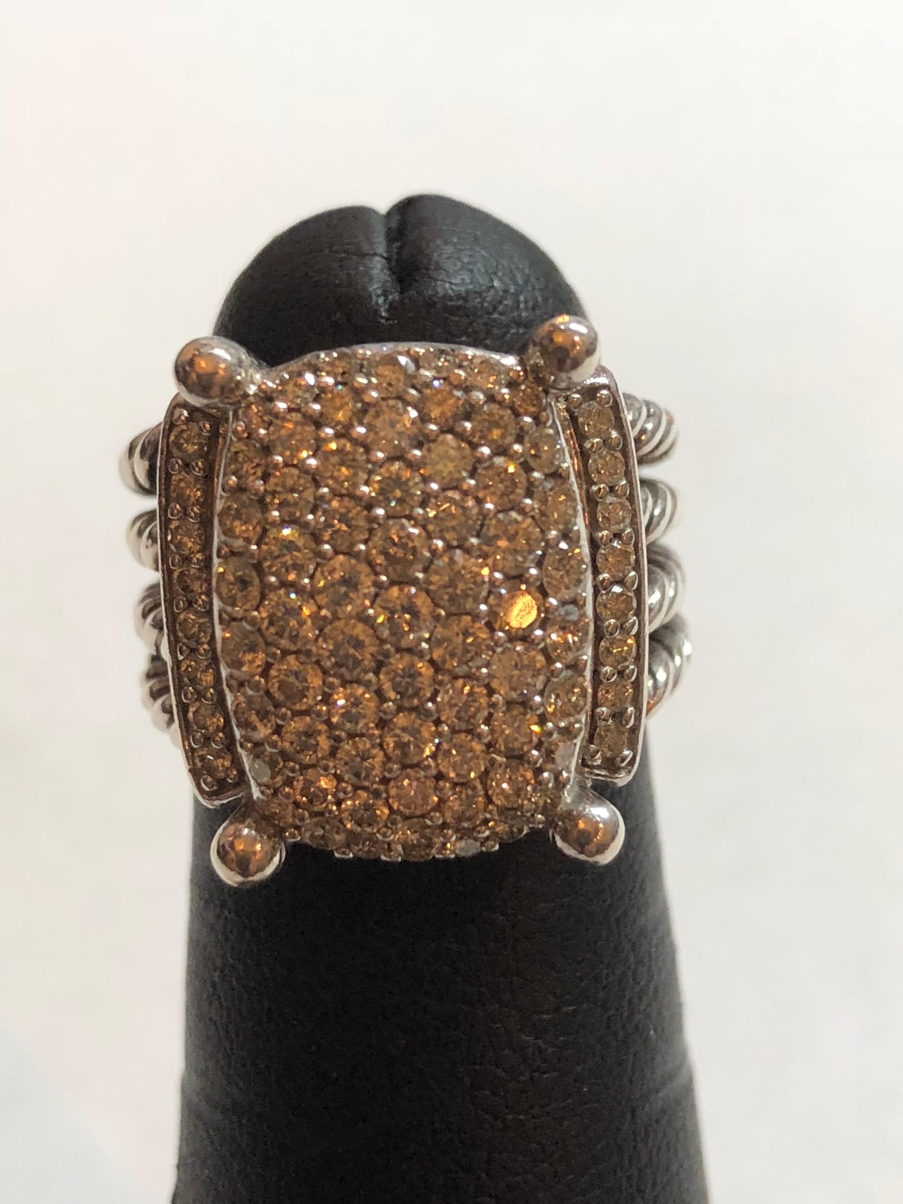 David Yurman Wheaton Ring with Diamonds
Pave Diamonds 1.12 Total carat weight
Center 16mm by 12mm
Ring 6mm wide
Diamonds are VS and I color
Sterling Silver
Size 5