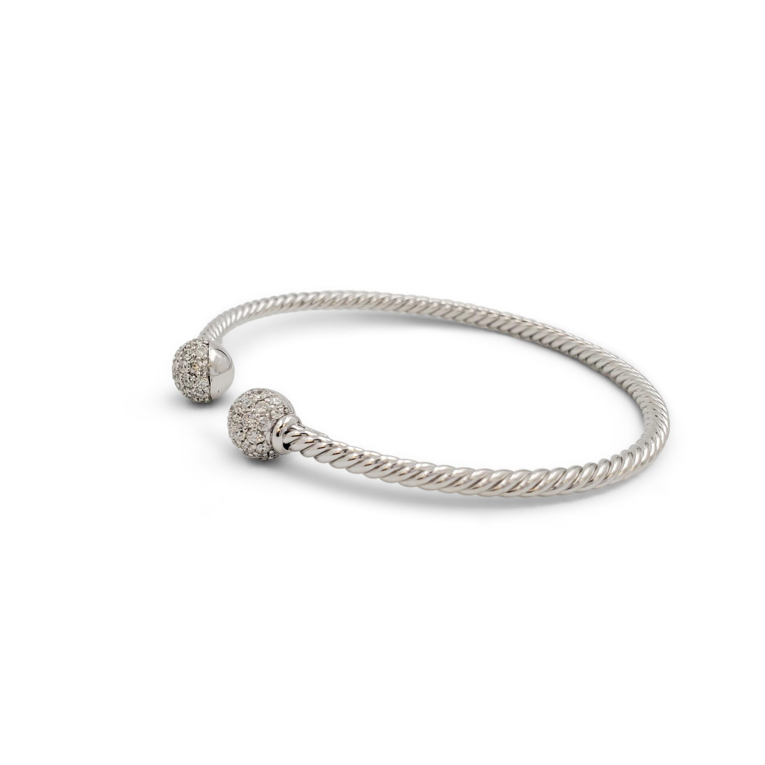 Authentic David Yurman 'Petite Solari Bead' bracelet crafted in 18 karat white gold. Each end of the thin cable-like bracelet is completed with a diamond pave set sphere. Signed DY, 750. The bracelet is not presented with the original box or papers.