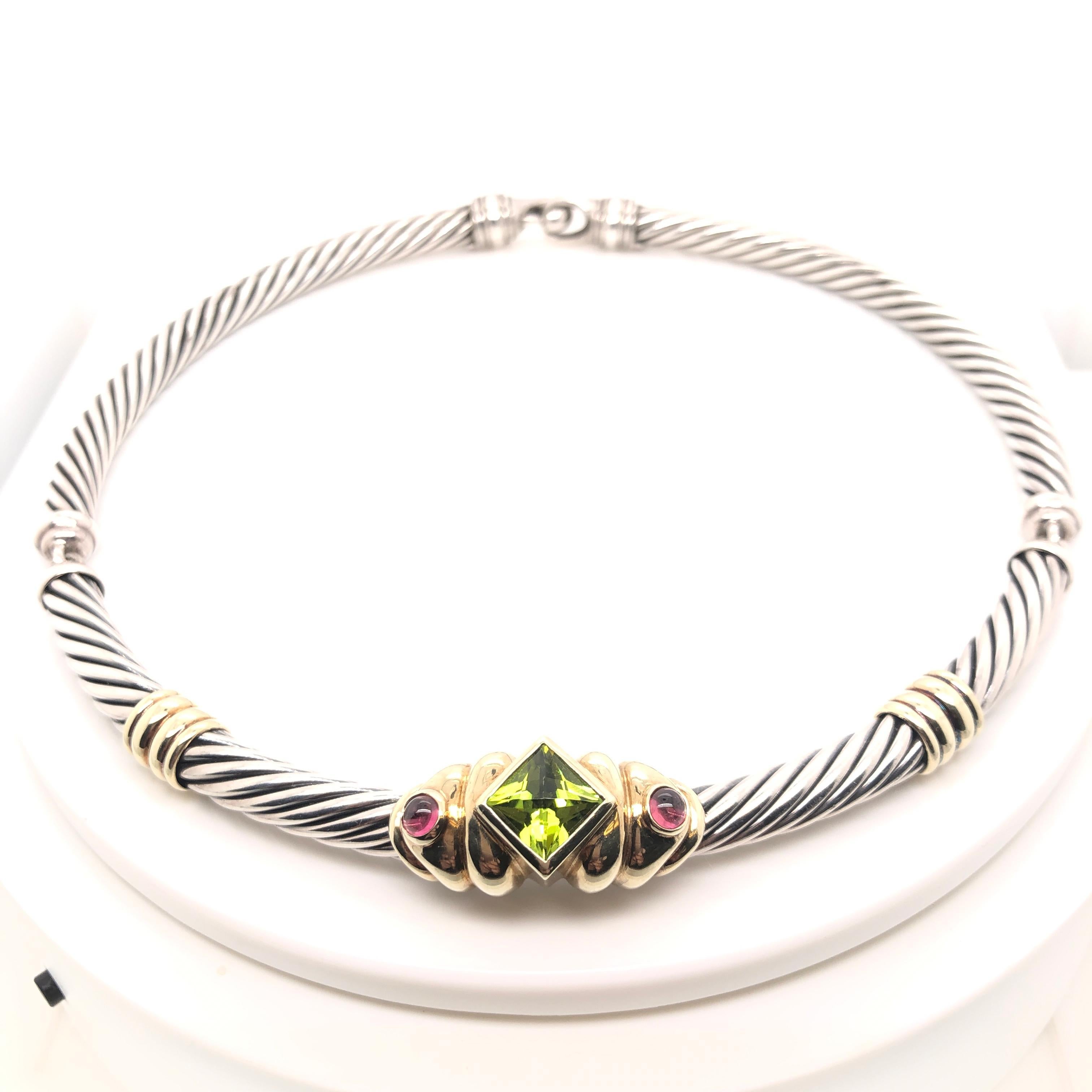 18K yellow gold and sterling silver cable collar necklace including peridot and pink tourmaline.

Stamped: © D. Y. 925, 585


