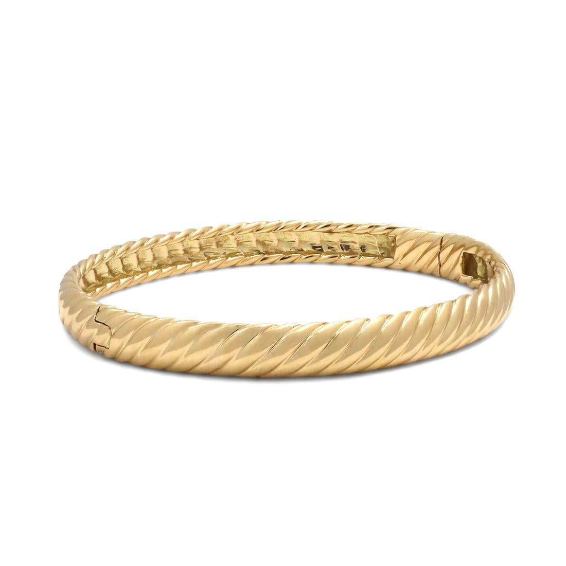 Authentic David Yurman bangle crafted in 18 karat yellow gold. Signed D.Y., 750. Will fit up to a 6 1/2 inch wrist. The bracelet is not presented with the original box or papers. CIRCA 2010s.

Brand: David Yurman
Metal: 18 karat yellow