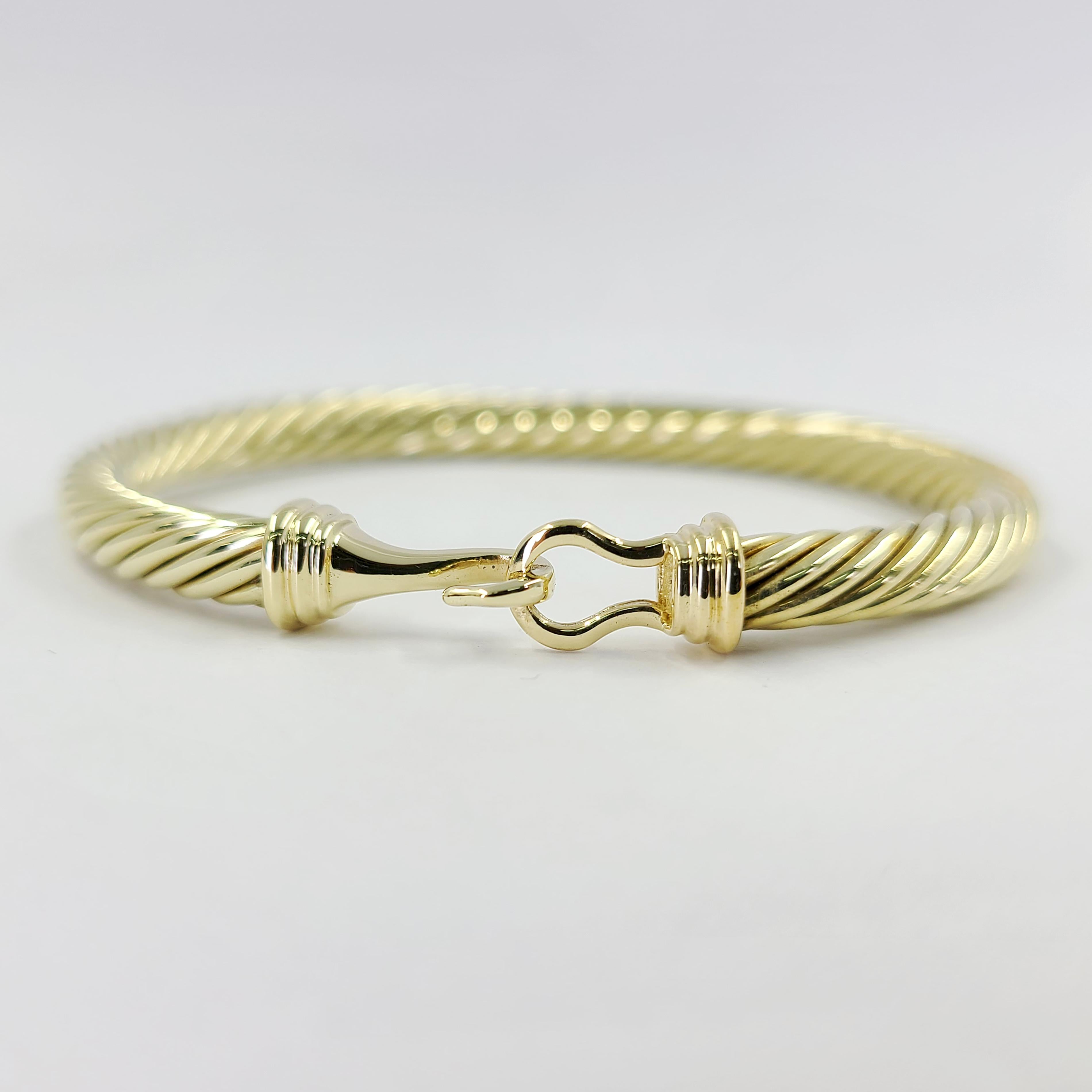 David Yurman 14 Karat Yellow Gold 5mm Hook Bangle With Cable Design. Finished Weight is 13.7 Grams.