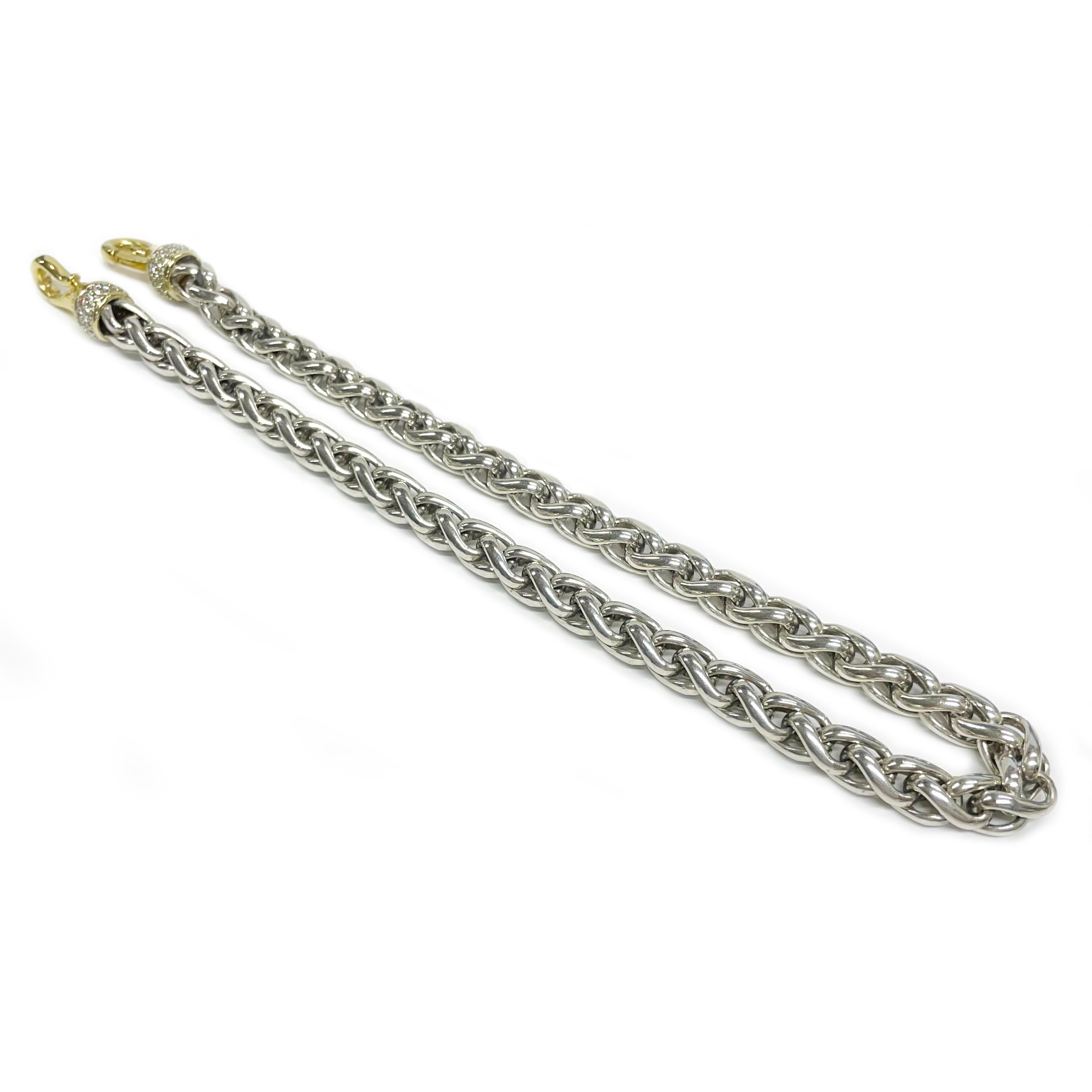 David Yurman 18 Karat Yellow Gold Sterling Diamond Necklace. The two-tone link chain necklace features an 18 karat yellow gold smooth clasps with pave diamond details and the classic Yurman cable design in sterling silver. The diamonds are 1.3mm for