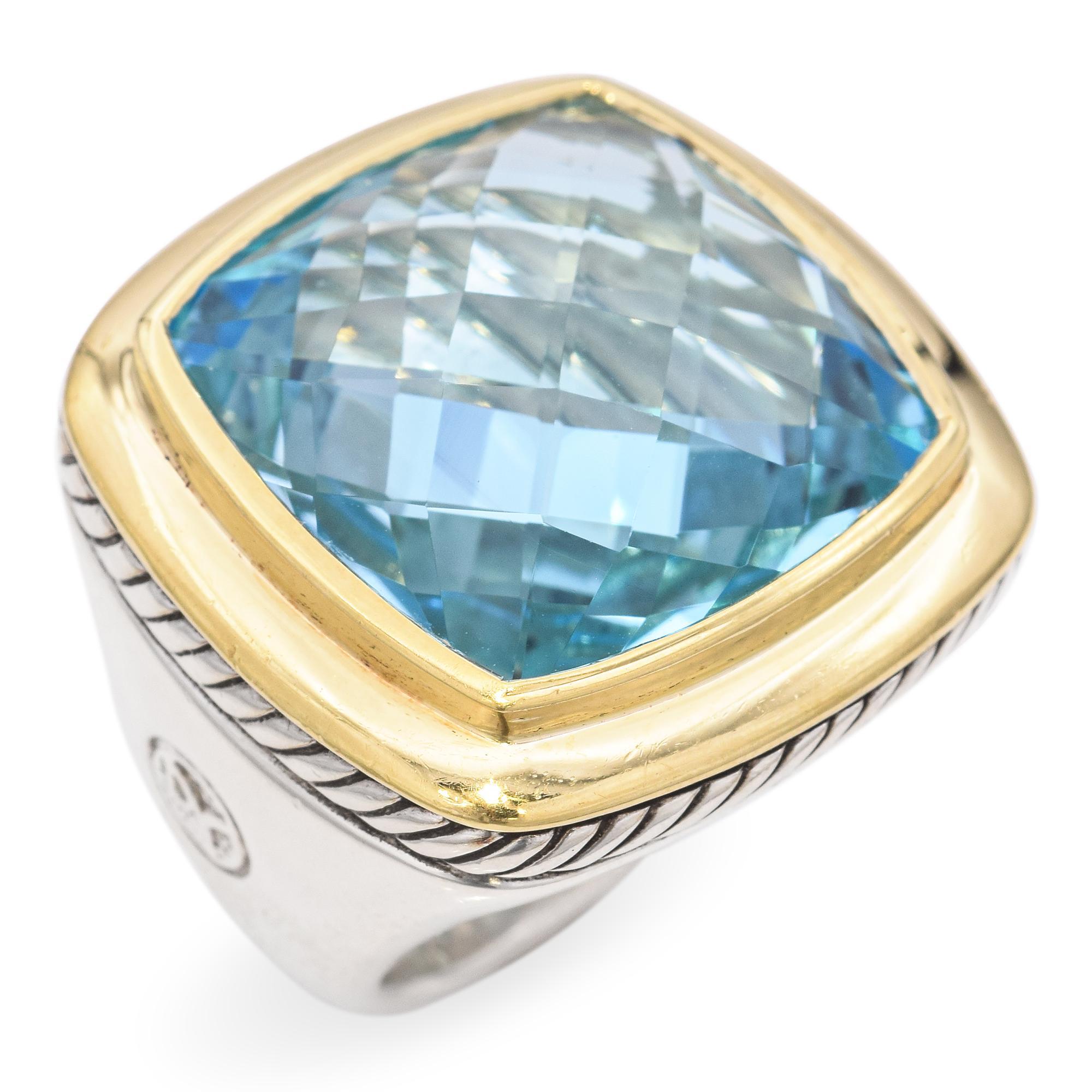 Elegant Cushion-Cut Blue Topaz Gold Ring. This exquisite ring features a stunning cushion-cut blue topaz, set in a sleek gold bezel. The topaz displays a captivating array of light and color, enhanced by its expertly faceted surface. The gold