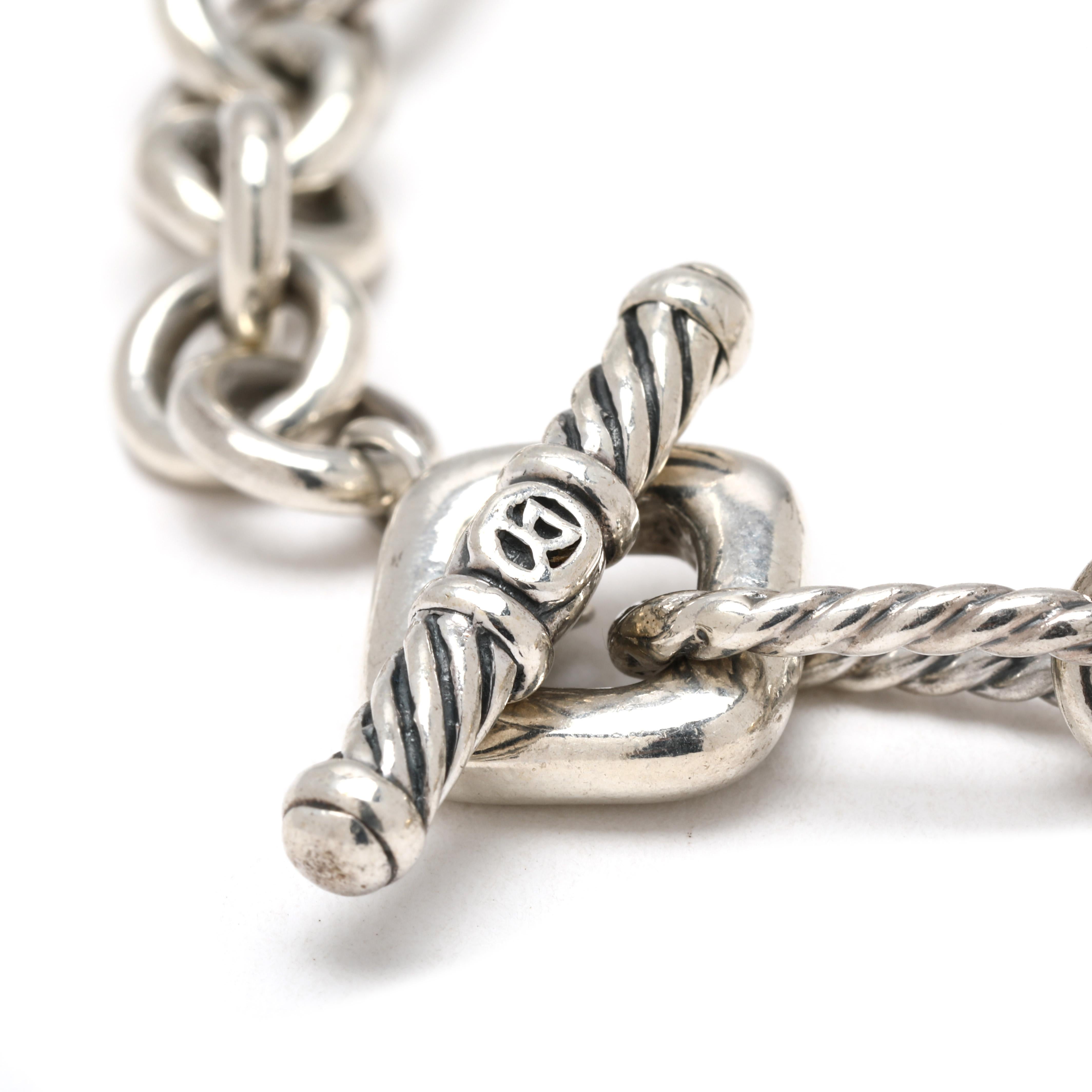 Length: 7.25 inches

Chain Width: 7.5 mm

Weight: 14.9 dwts. / 23.2 grams

Stamps 