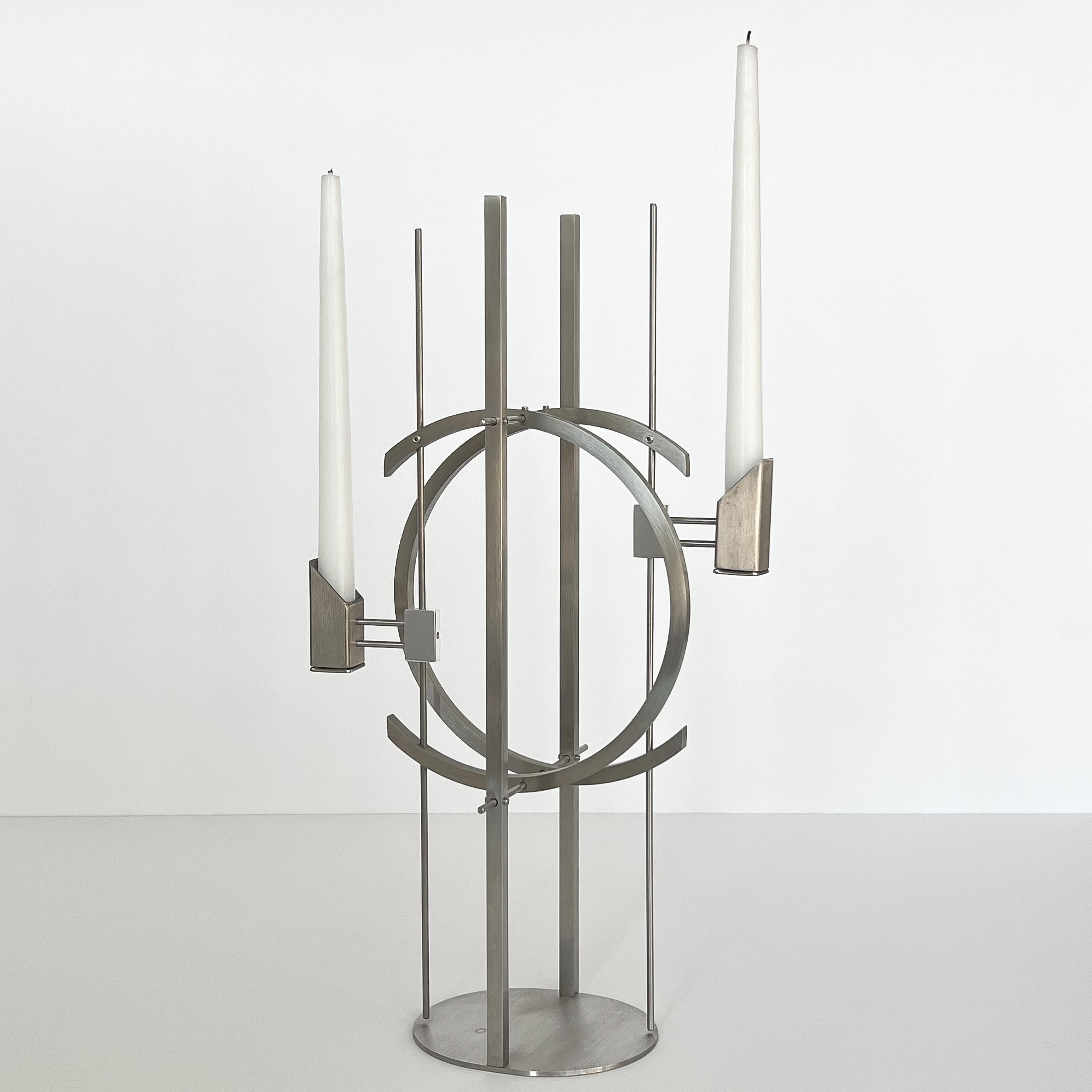 An architectural and sculptural candle holder by David Zelman, USA circa 1980s. Produced through Zelman's design firm Prologue 2000. Postmodern and industrial in design. The firm's work utilizes Industrial images to create beautiful formed