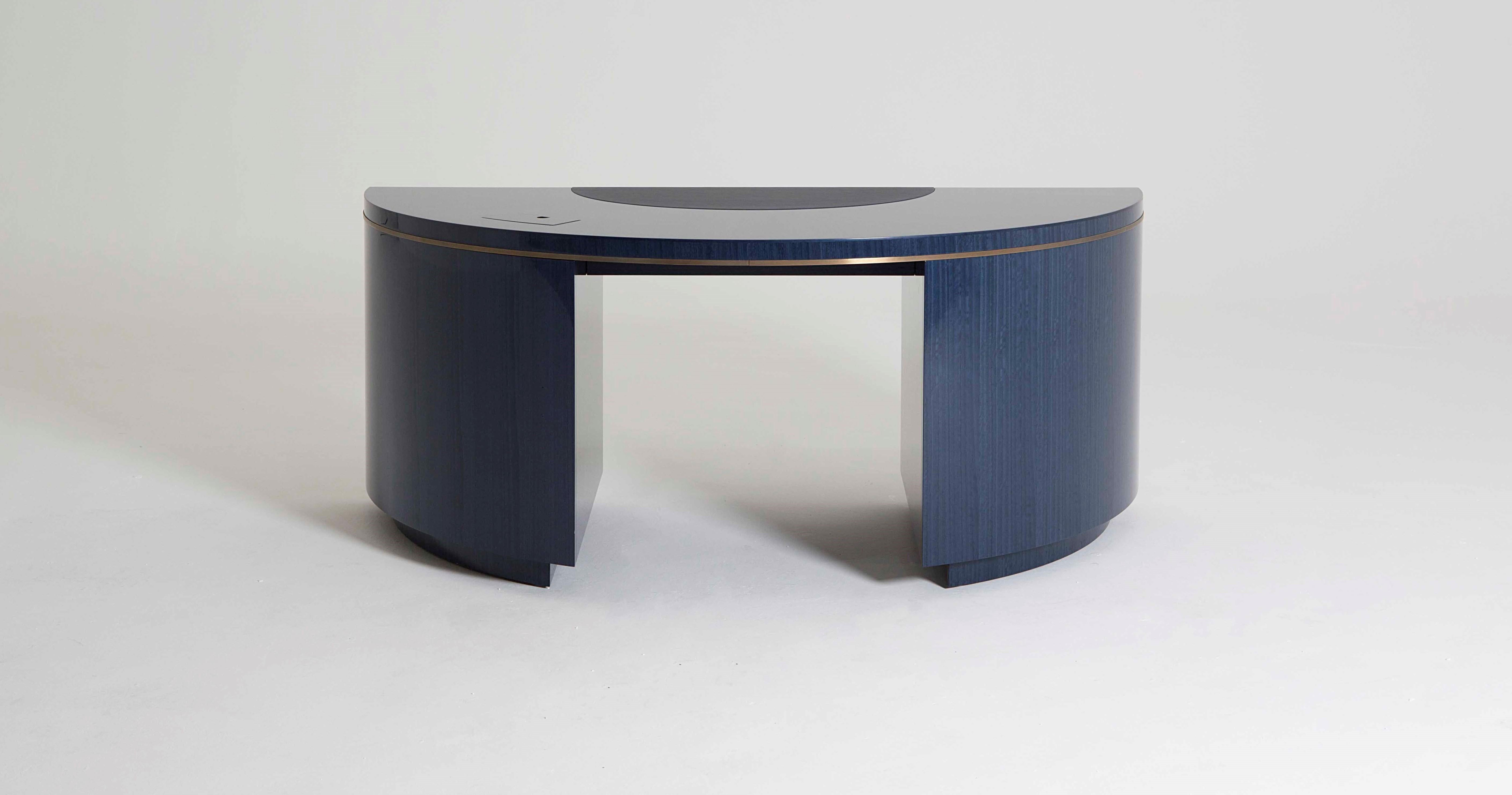 The table was inspired by the work of French designer Émile-Jacques Ruhlmann, one of the key figures in 1930s Art Deco. His designs are the epitome of sleek and sophisticated, using expensive and exotic materials combined with an impeccable