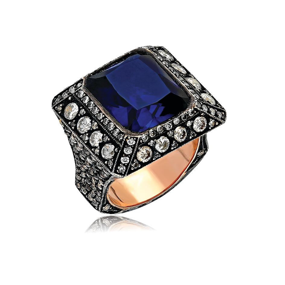 8k gold and silver ring with a manmade sapphire (13.50ct), white diamonds (2.00ct) and champagne diamonds (1.8ct).