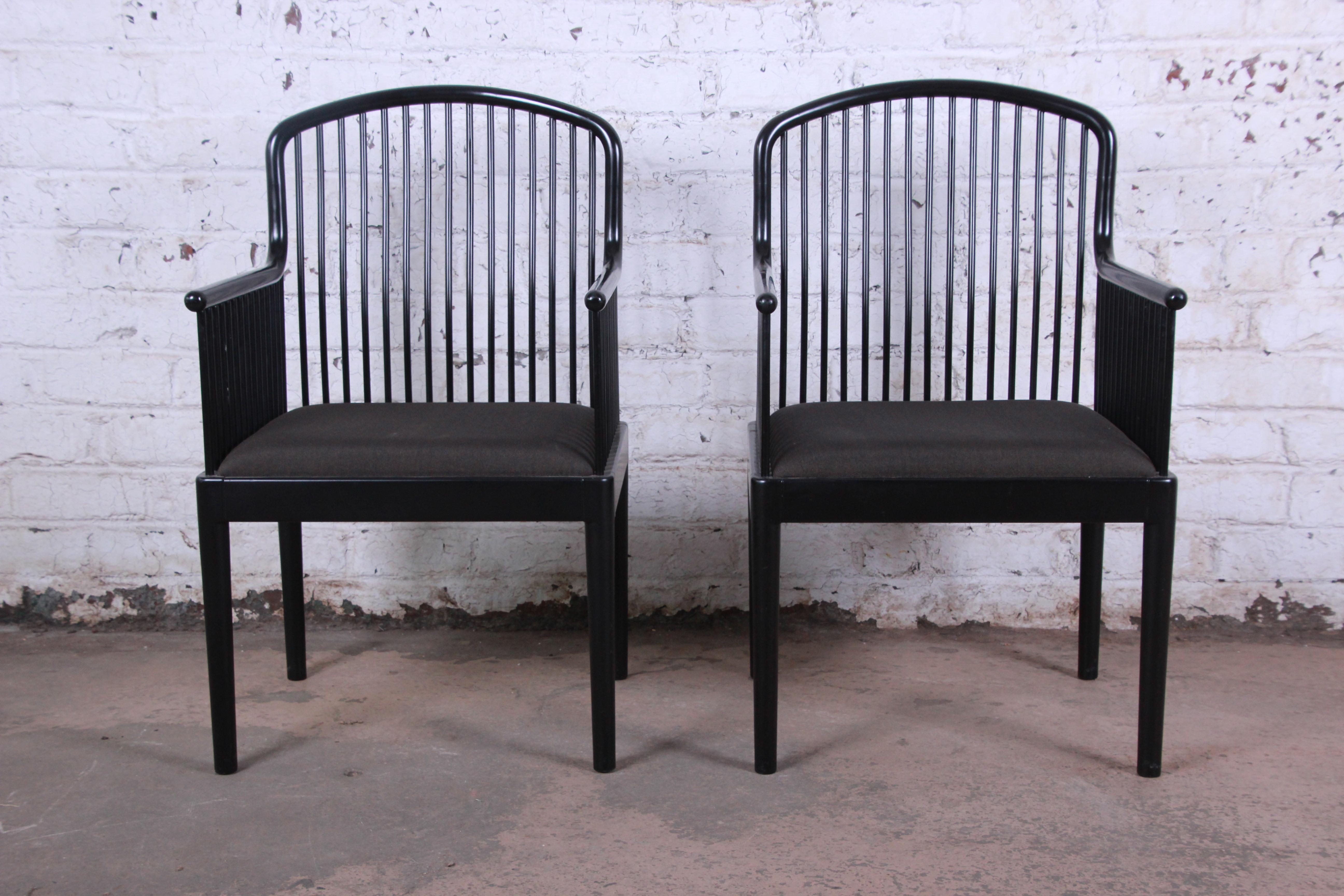 An exceptional pair of Andover black lacquered spindle armchairs designed by Davis Allen and made in Italy by Stendig, circa 1980. The chairs feature solid beech frames with a striking black lacquer finish and original charcoal gray upholstery. A