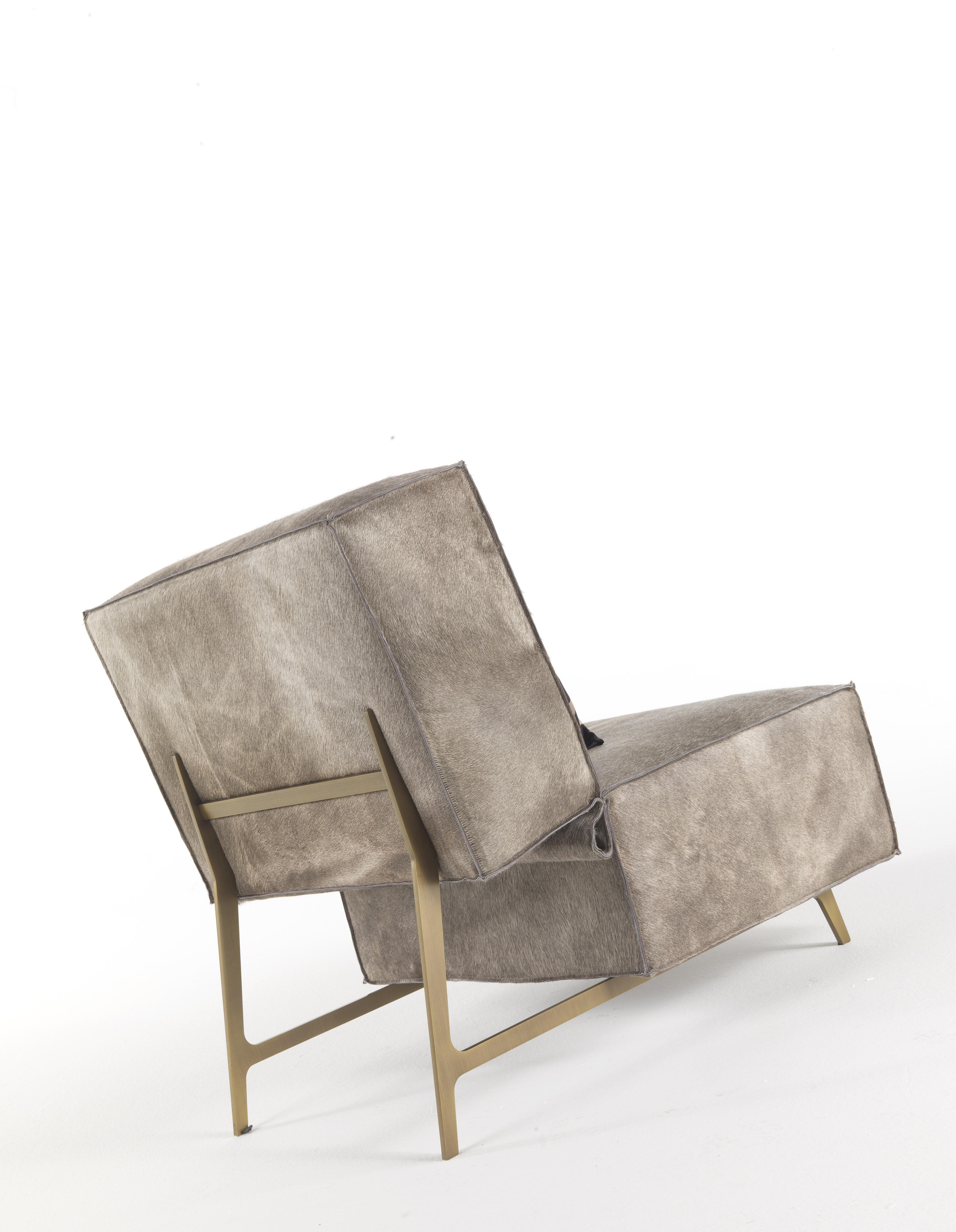 With its graceful lines and compact proportions, Davis armchair creates an intimate conversation area. This refined armchair is raised off the floor on thin bronze brushed legs for an effect of overall lightness.

Davis Armchair with structure in