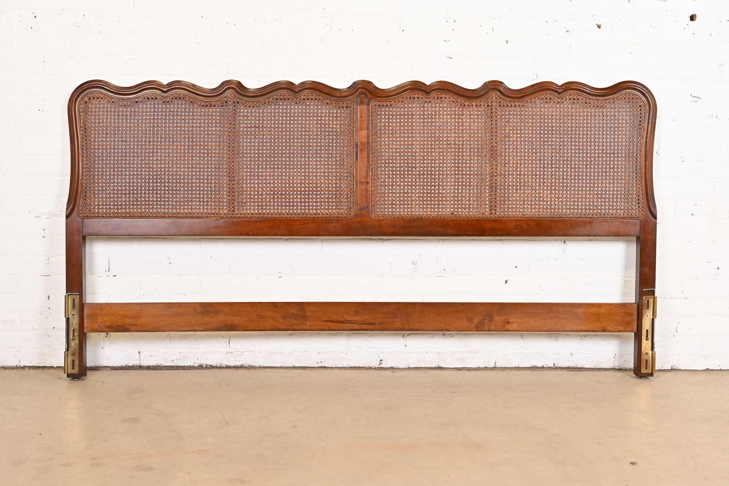 A beautiful French Provincial Louis XV style king size headboard

By Davis Cabinet Company

USA, Circa 1960s

Carved cherry wood, with caned panels.

Measures: 79.75