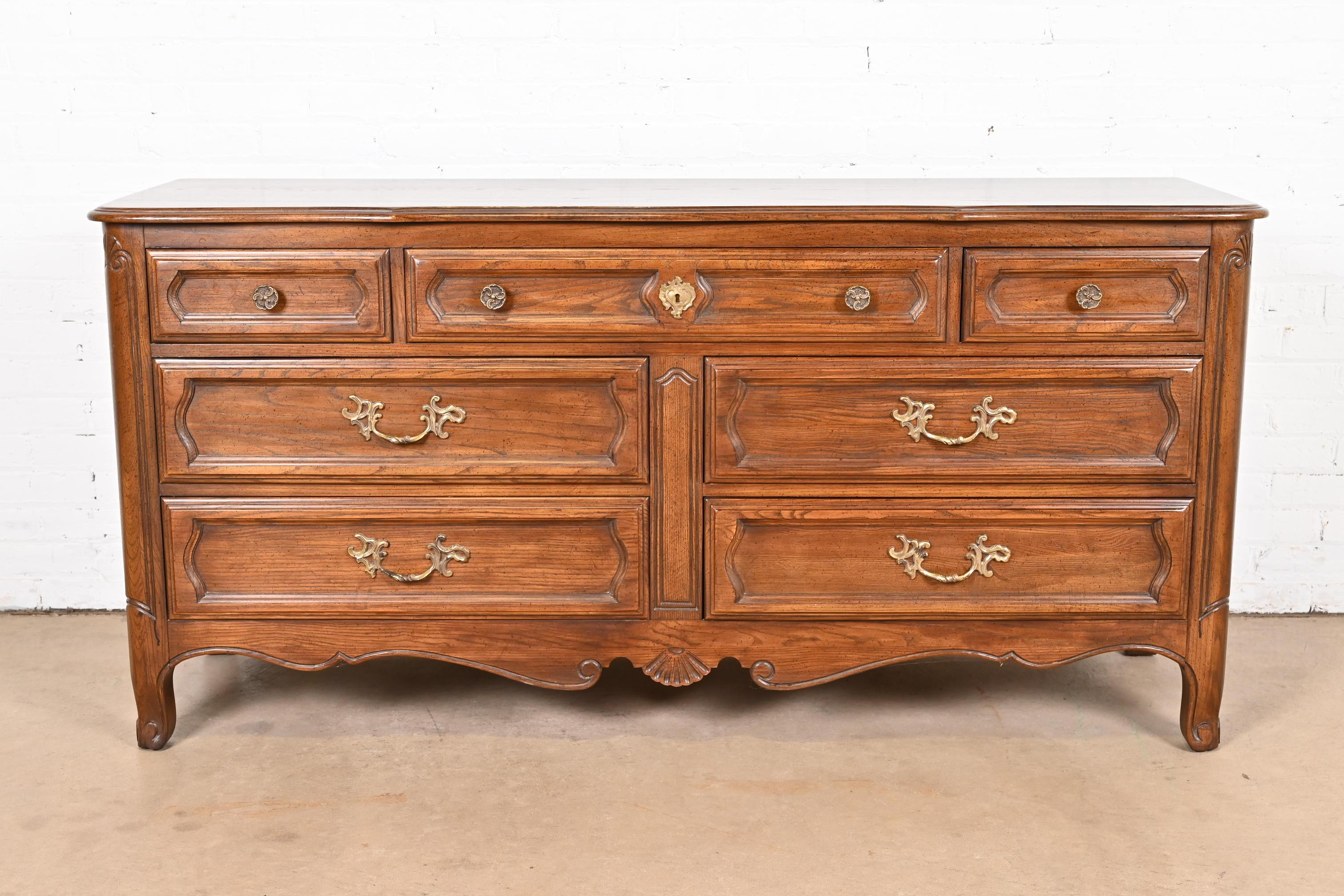 American Davis Cabinet Company French Provincial Louis XV Carved Oak Dresser For Sale