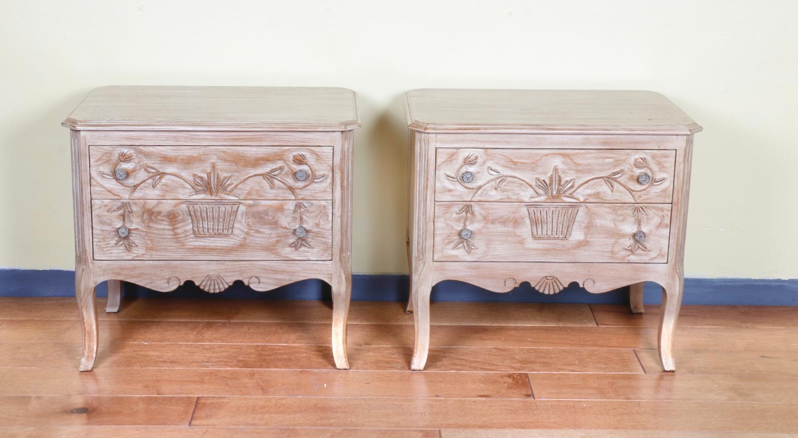 Antique pair of solid wood nightstands by Davis Cabinet Company. Beautiful detailed carvings. Very elegant looking with nice wood white wash grain. Will look amazing in any bedroom. 
Lots of storage space with working sliding drawers.