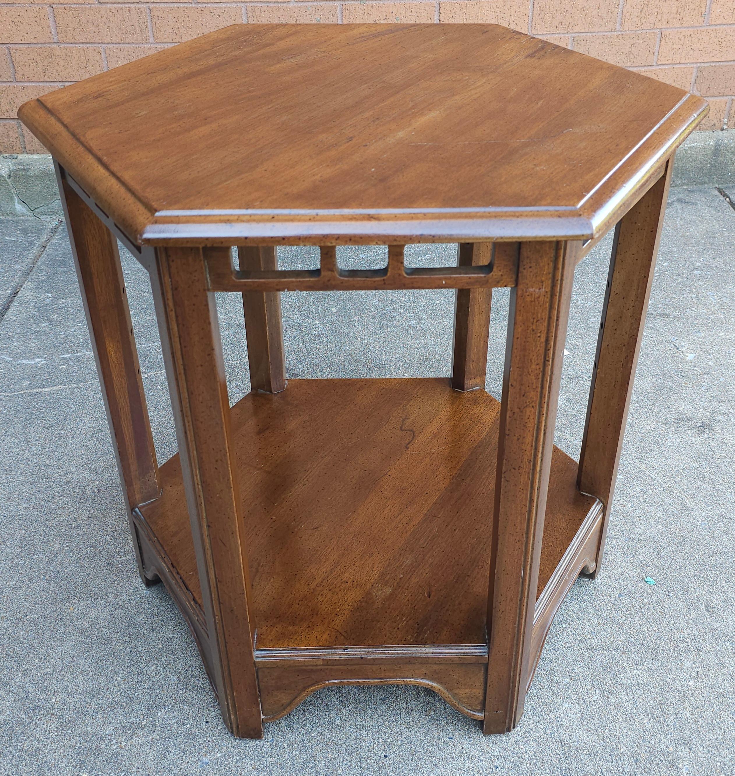 A Davis Cabinet Hexagonal Walnut Side Table. Measures 25.5