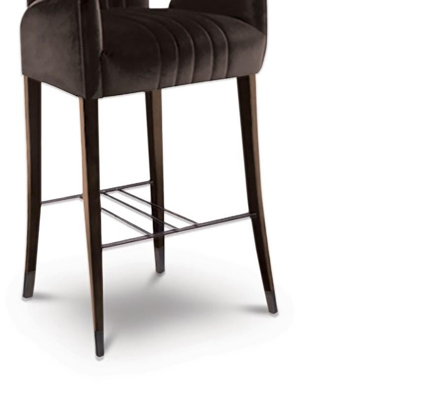 The Davis Sea, located along the coast of East Antarctica, inspired our designers to create DAVIS Counter Stool. Featuring legs in ash with walnut stain matte varnish, this upholstered bar stool with back will add character and elegance to any
