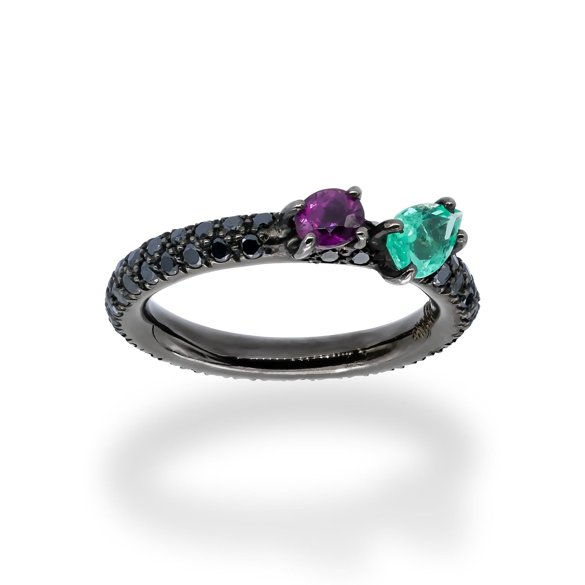 A Ring from d'Avossa Rainbow Collection in black 18 kt gold with a pavé of 1.15 cts of black diamonds and a central pear shape emerald of 0.45 cts  together with a purple sapphire of 0.56 cts
This Ring has been designed to be worn alone, or together