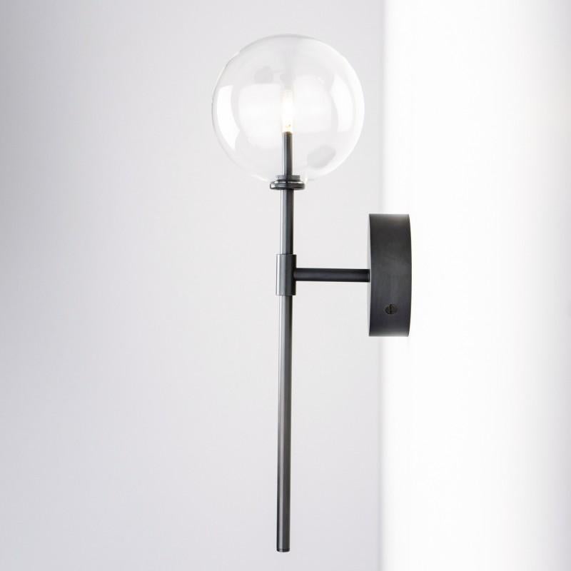 Black gunmetal wall sconce by Schwung.
Dimensions: D 19.3 x W 15 x H 50.5 cm.
Materials: solid brass, hand-blown glass globes.
Finish: black gunmetal.
Available in finishes: polished nickel or natural brass.
All our lamps can be wired according