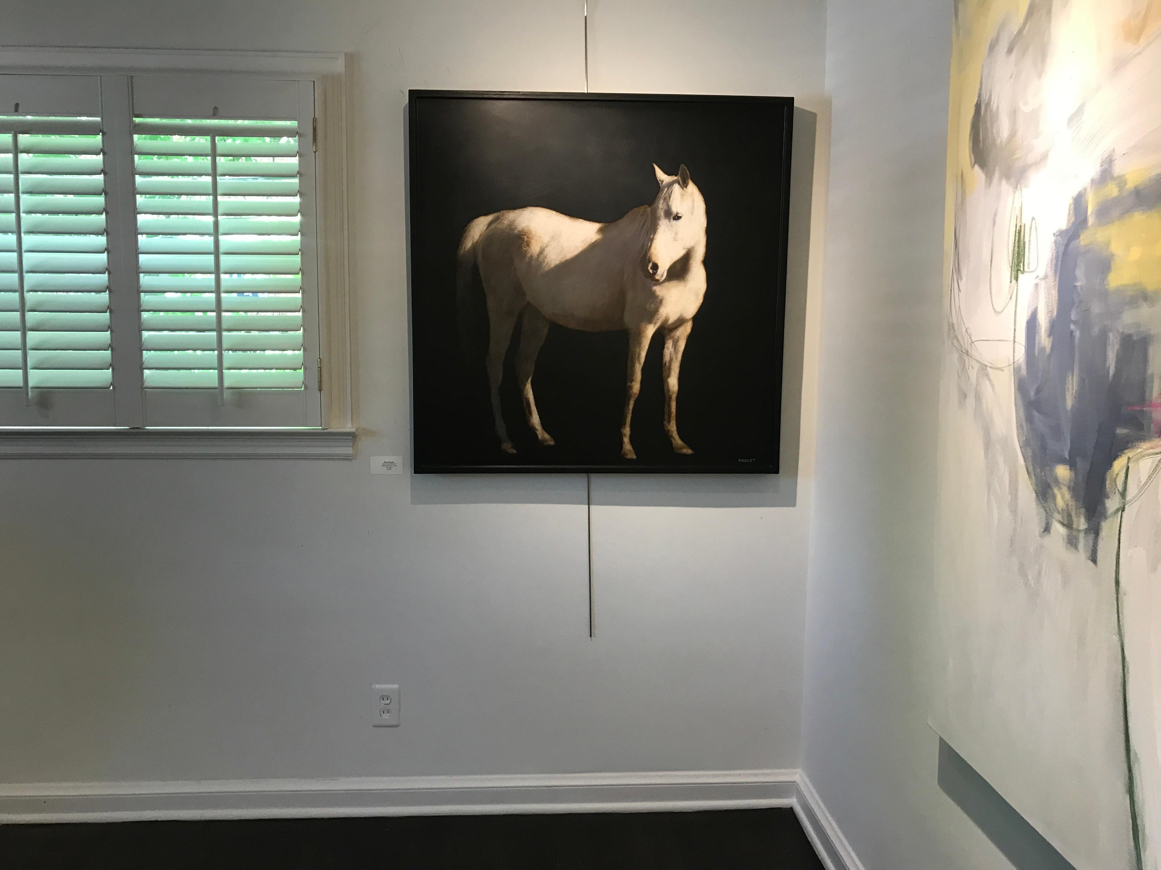 'Spur of the Moment' is a 2019 figurative mixed media on board horse painting created by American artist Dawne Raulet. Featuring a dark background allowing the subject to capture the entirety of the light, the painting depicts a white horse seen
