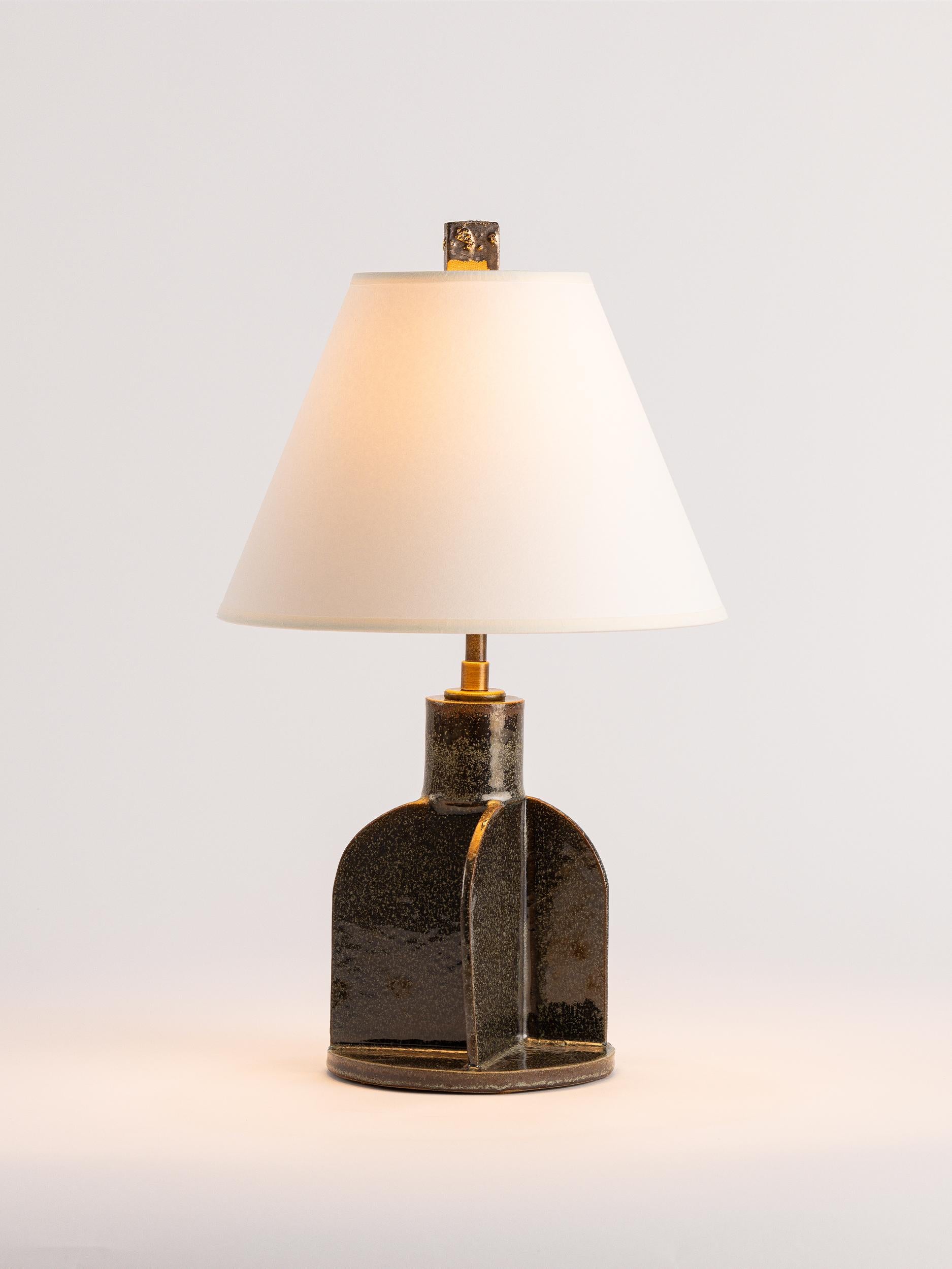 Our stoneware lamp is handcrafted using slab-construction techniques.

FINISH

- Woodland dipped glaze
- Archival paper shade
- Cracked gold finial

LAMPING

Provided with dimmable Tala LED light bulbs

DIMENSIONS

Lamp Height – 8.5”
Lamp Base –