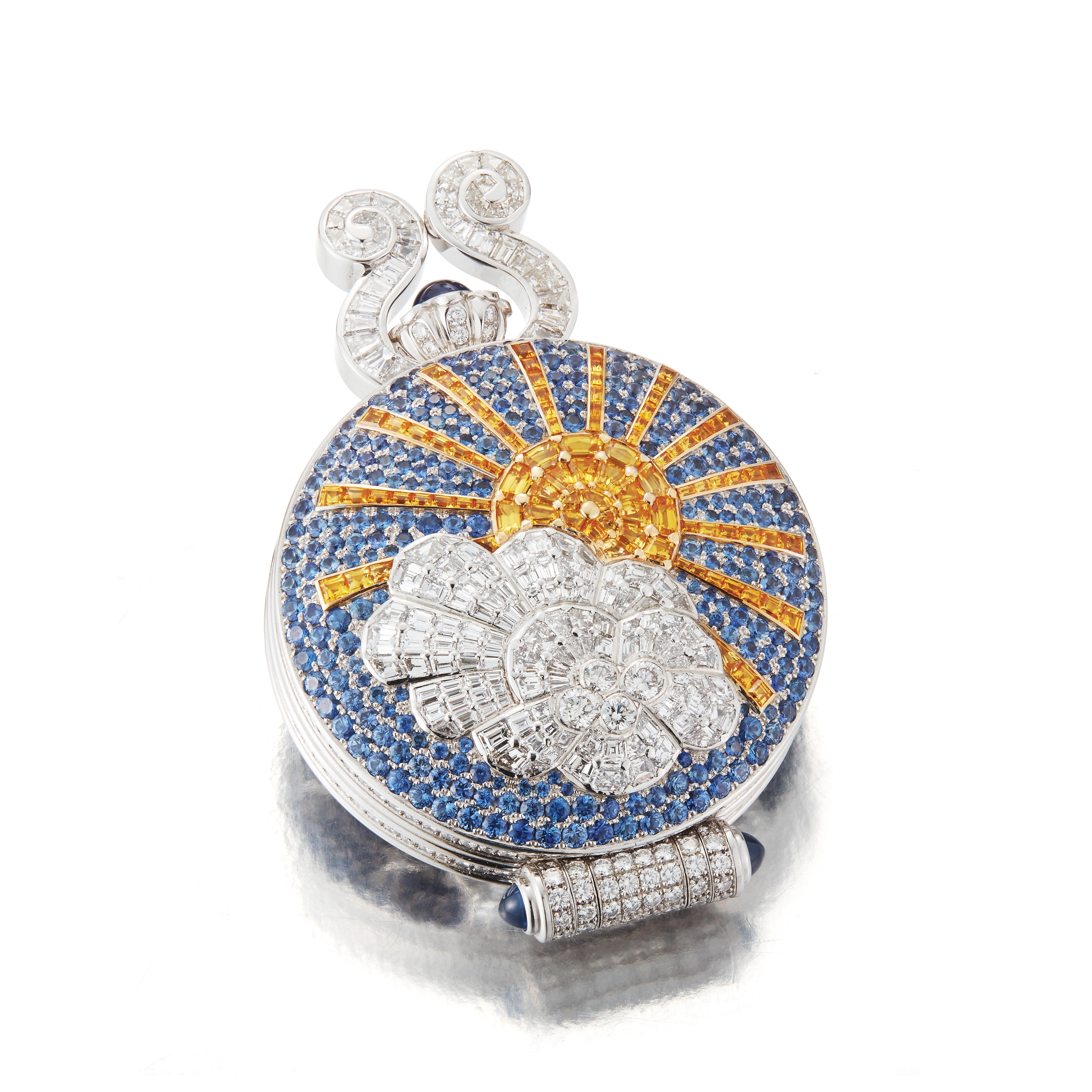 This one of a kind pocket watch was made with 18k white gold, with a yellow sapphire sun partially covered by a diamond-set cloud set across a blue sapphire sky. The backside of the watch depicts a night sky made of dark blue sapphires with a yellow