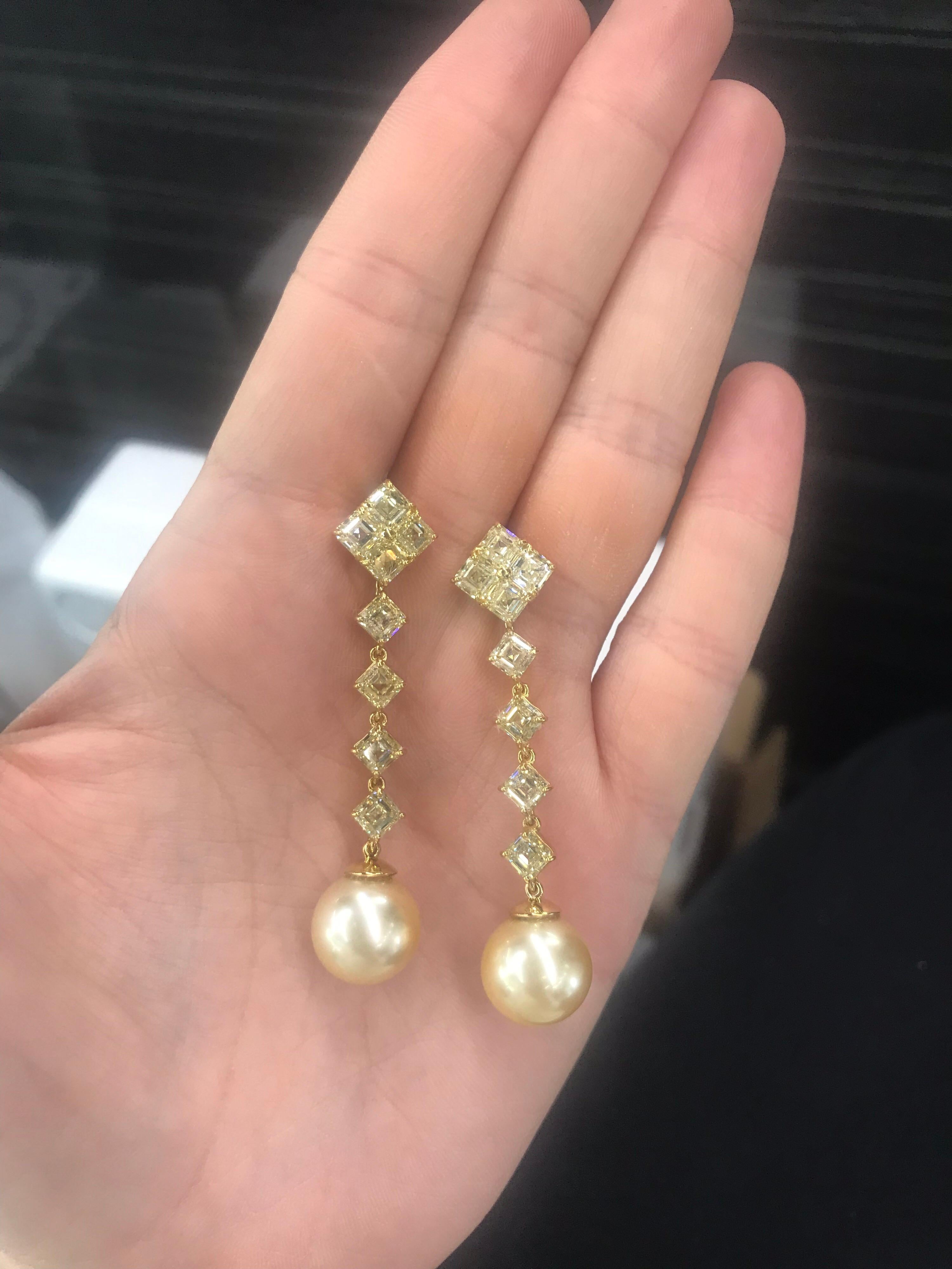 Day & Night, 22K Yellow Gold earrings featuring 16 Asscher cut Fancy Light Yellow diamonds weighing 9.01 Carats, VVS2-VS1, with two golden South Sea pearls.

Top of the earring can be worn as a stud. 
Much more impressive in person. A beautiful