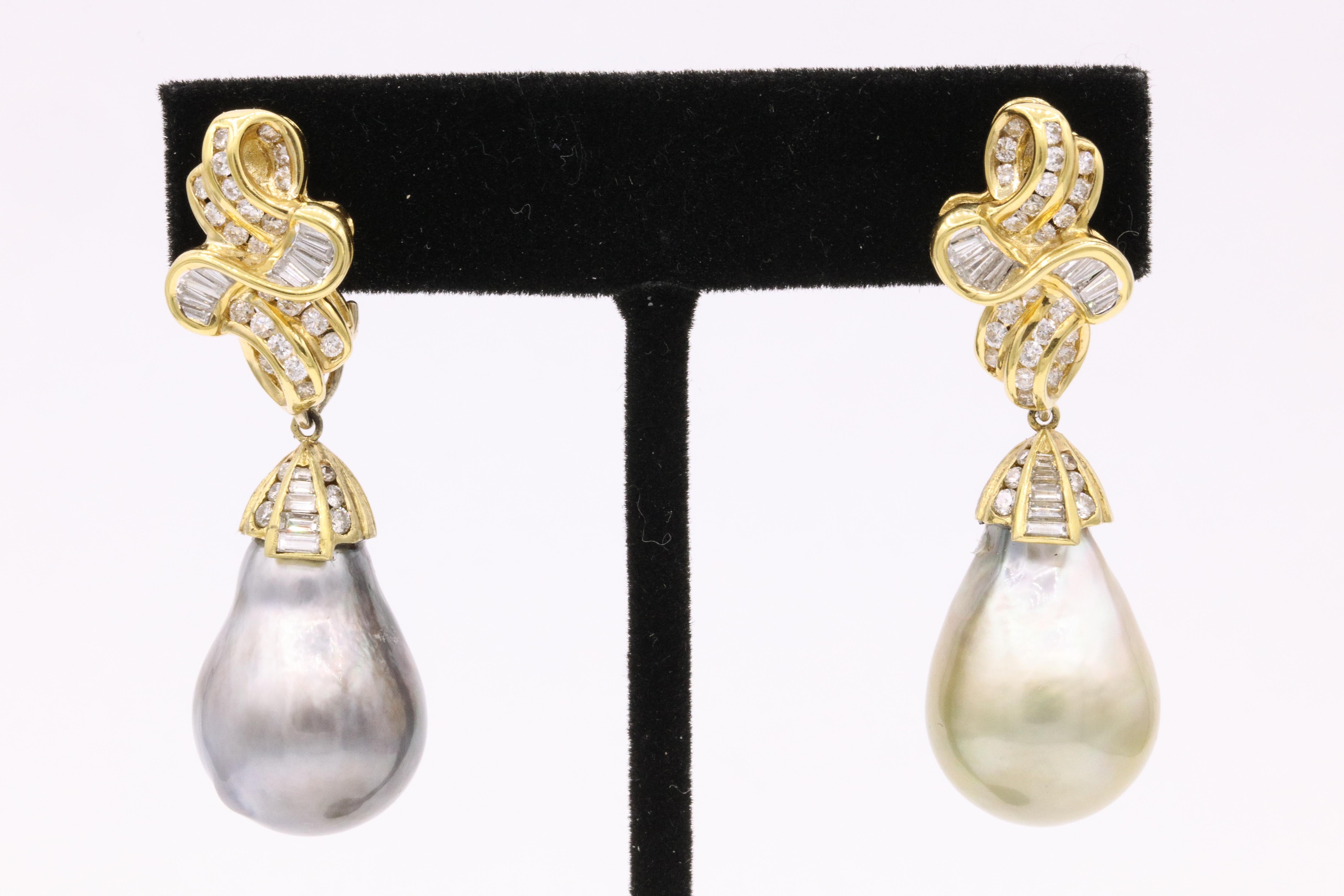 18K Yellow gold earring featuring two Tahitian pearls, gun blue and pistachio color, with round brilliant and baguettes weighing approximately 4.50 carats. 
Pearl bottoms can be taken off by hook in the back. 