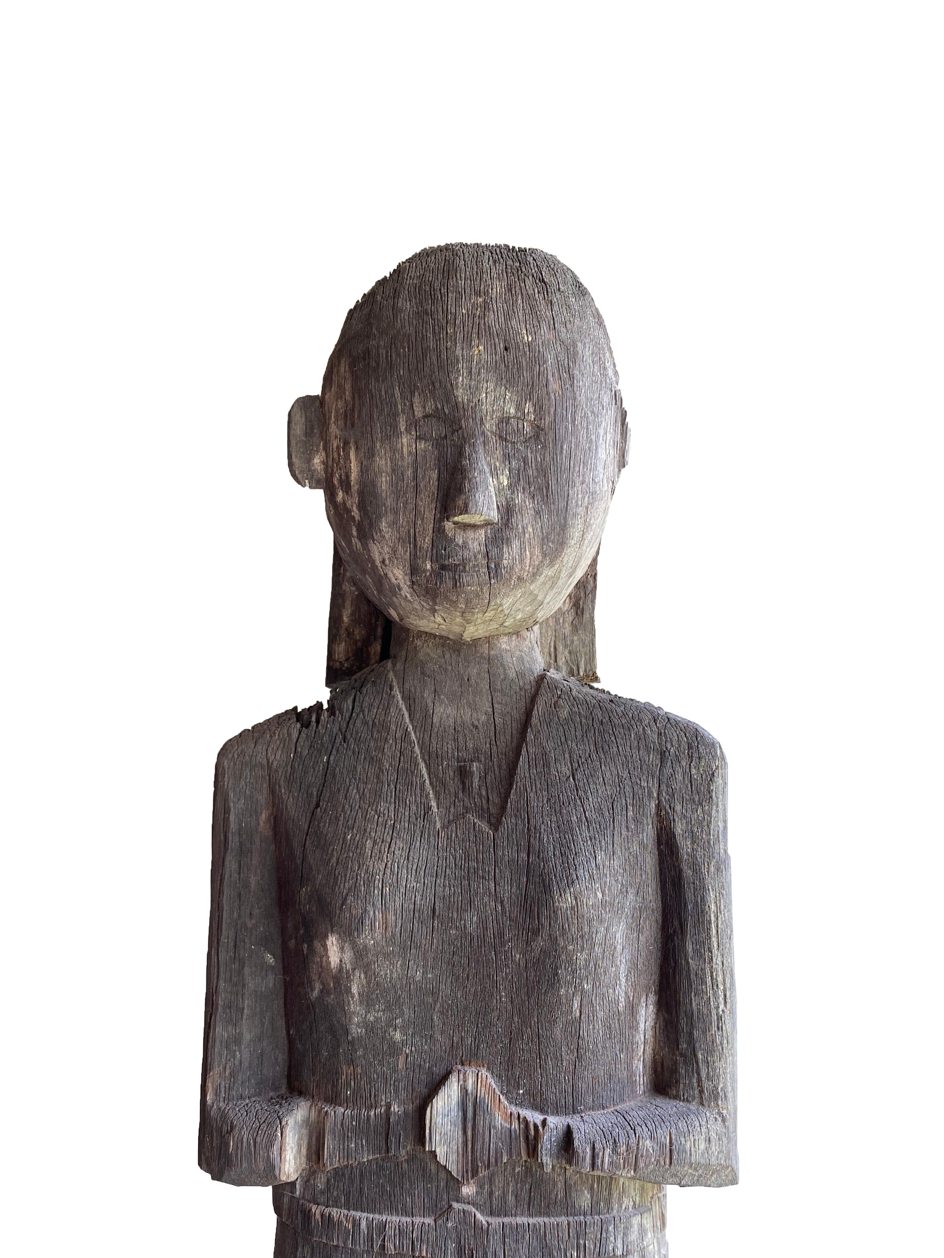 ‘Hampatong’ is the term used for ancestors and protective figures made of hard ‘iron wood’, which the Dayak of Borneo would position infront of their houses as guardians. This early 20th century sculpture features light grey age-related patina and