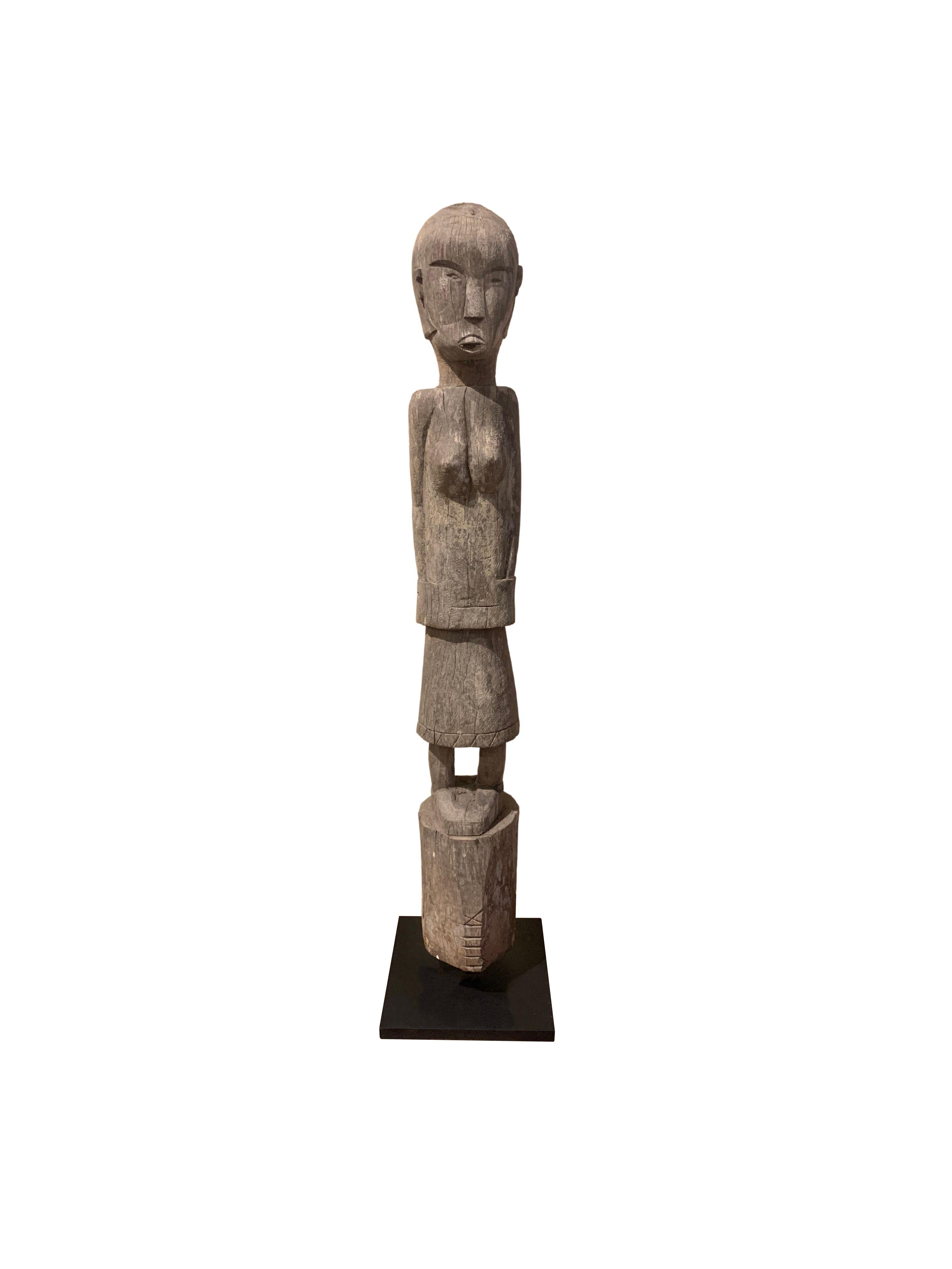 An exquisite example Kalimantan carved sculpture of a 