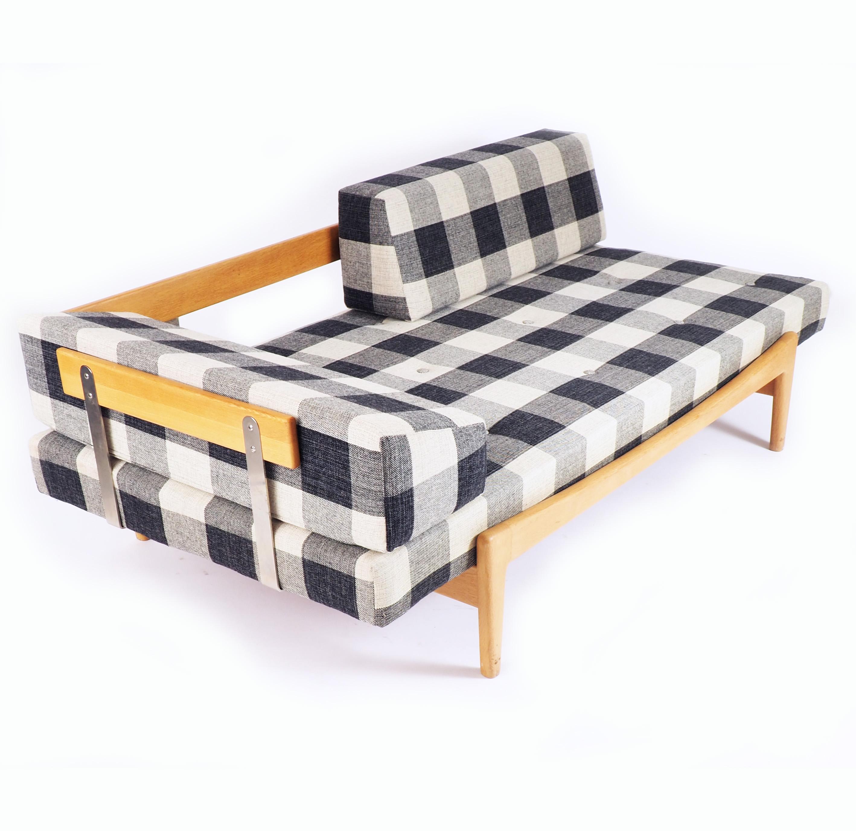 Daybed in excellent condition by Ib Kofod-Larsen for Seffle Möbelfabrik. Solid oak and original wollen fabric.
