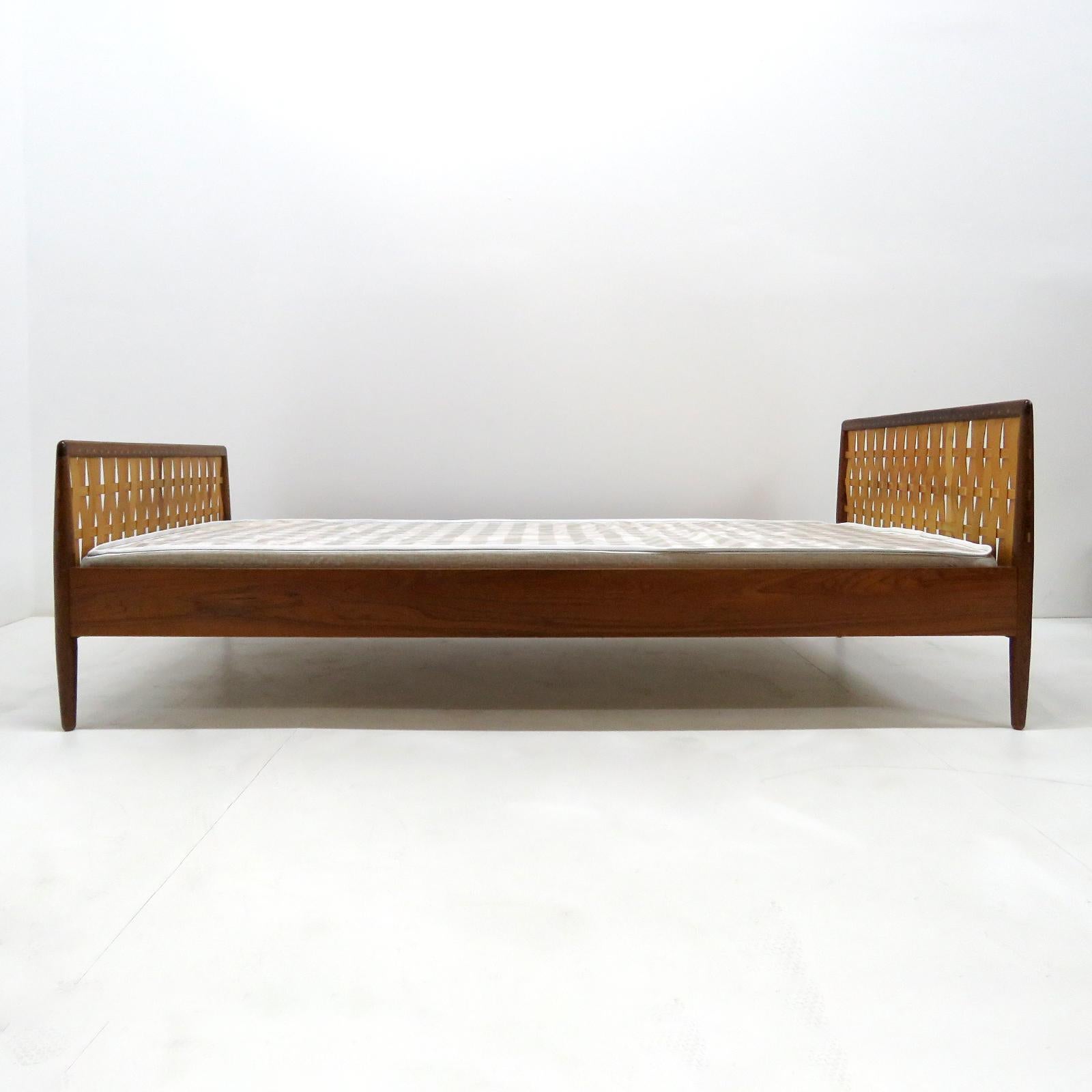 Wonderful daybed by Illums Bolighus in teak with woven wood headboard and metal spring frame, new European size mattress available upon request, marked.