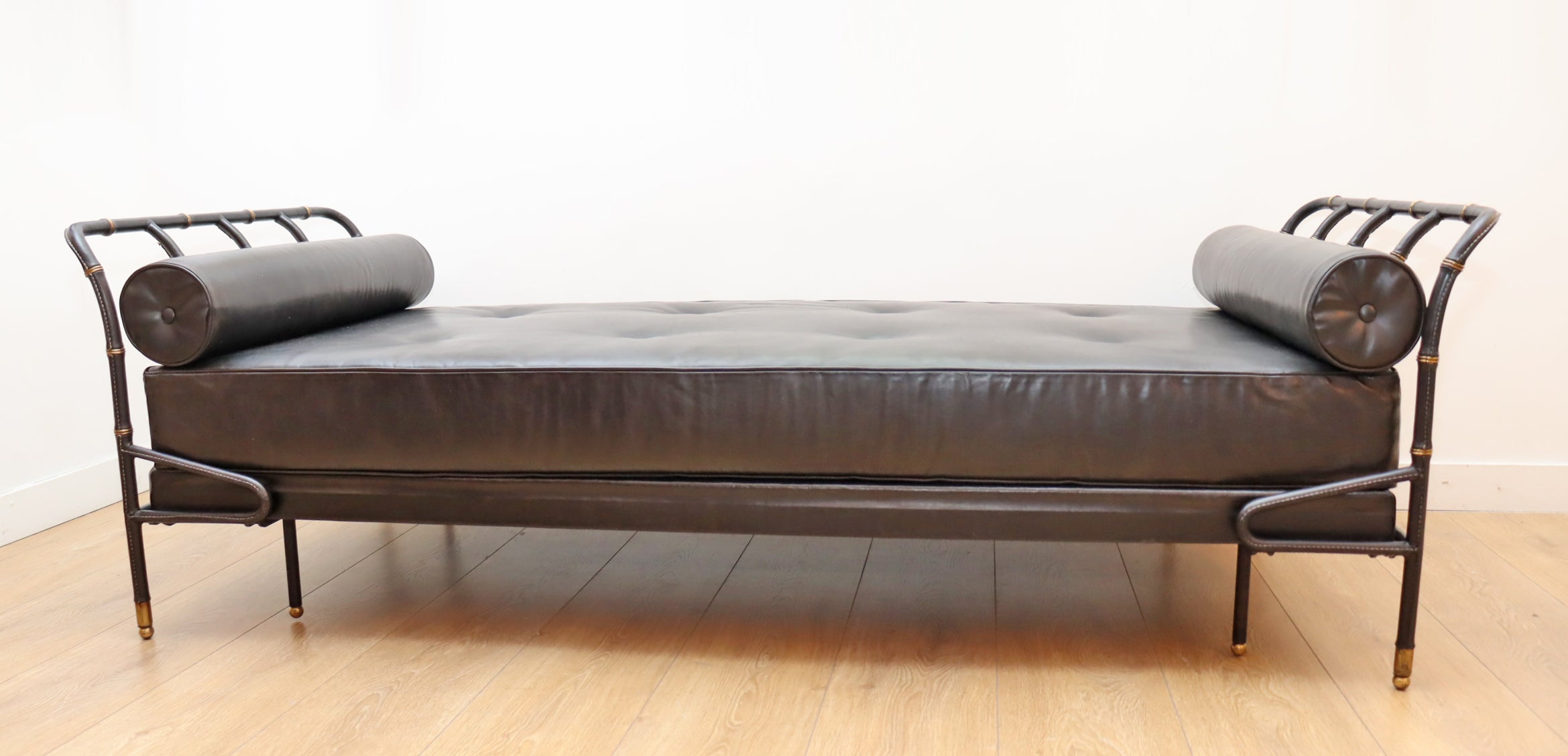 Daybed by Jacques Adnet black stitched leather and brass 
France circa 1950
Excellent condition, wear consistent with wear and use
Upholstered with black leather
Available to view in-situ in our Miami gallery