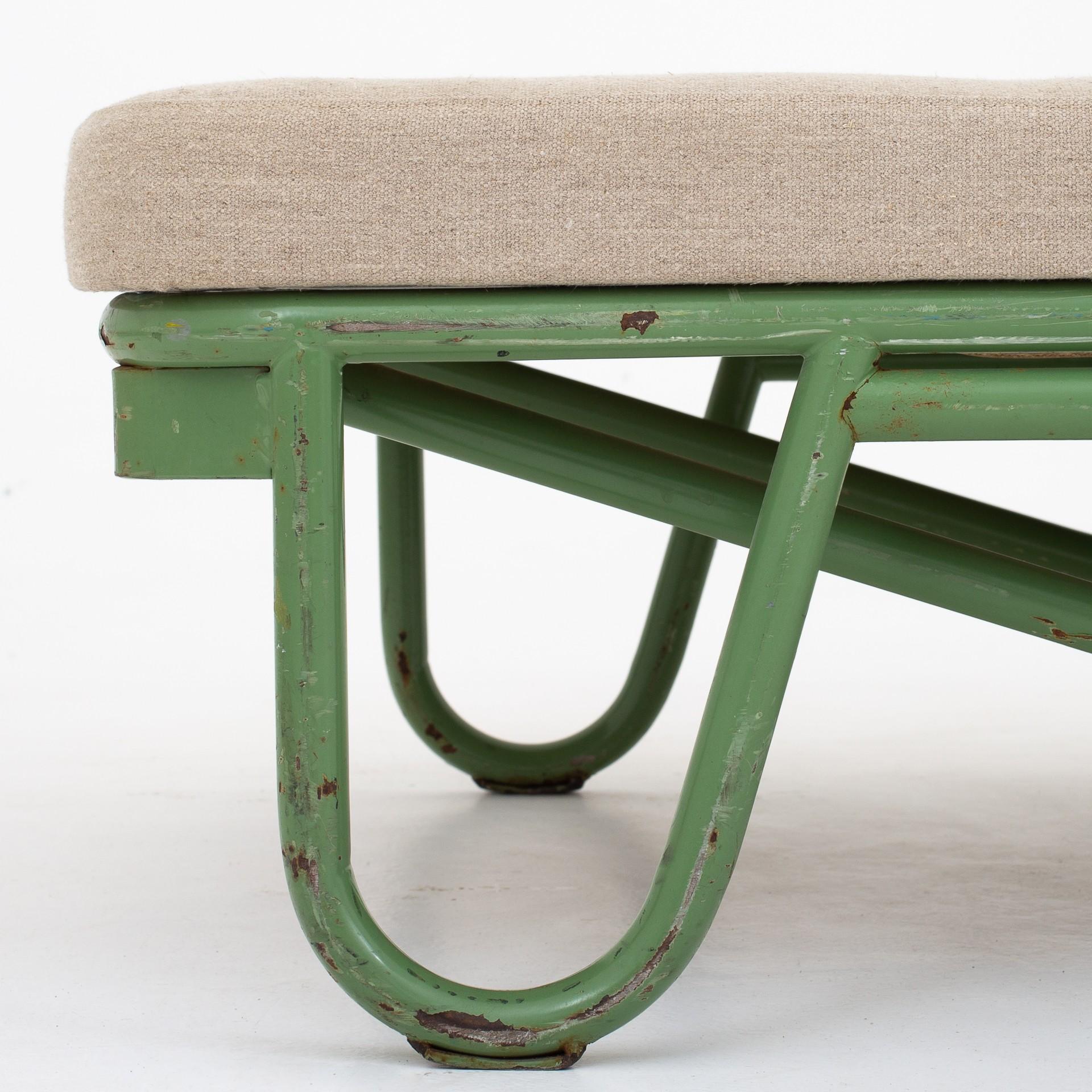 Daybed with green lacquered steel frame on wheels and new cushion in washed canvas. Two pieces in stock. Unknown design.