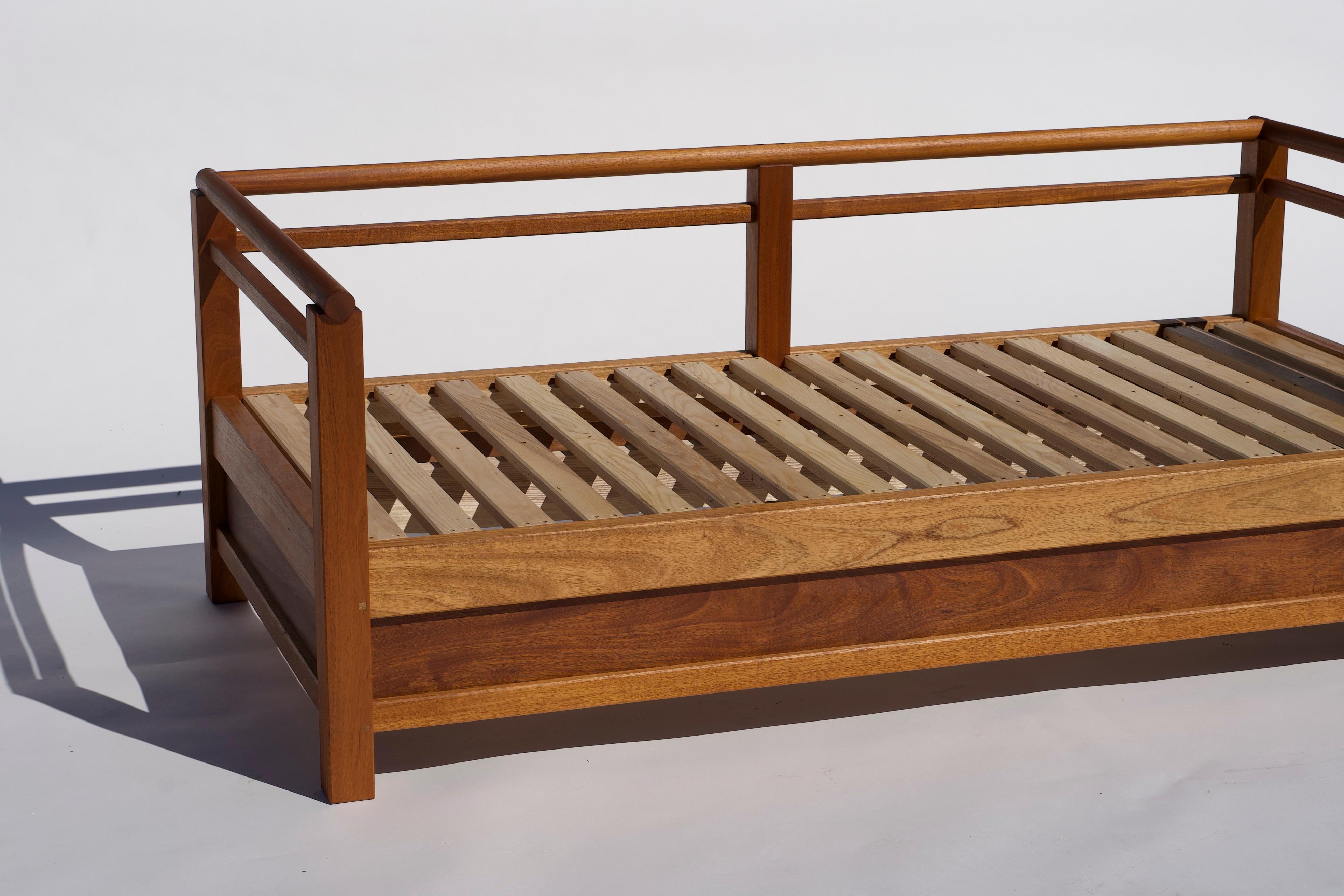 This daybed was inspired by the Uji bridge at Naiku temple in Japan. It is featured in Honduran mahogany and made for indoor/outdoor use in Honduran mahogany. This daybed is also available in oiled walnut or oiled ash. 

The construction of this