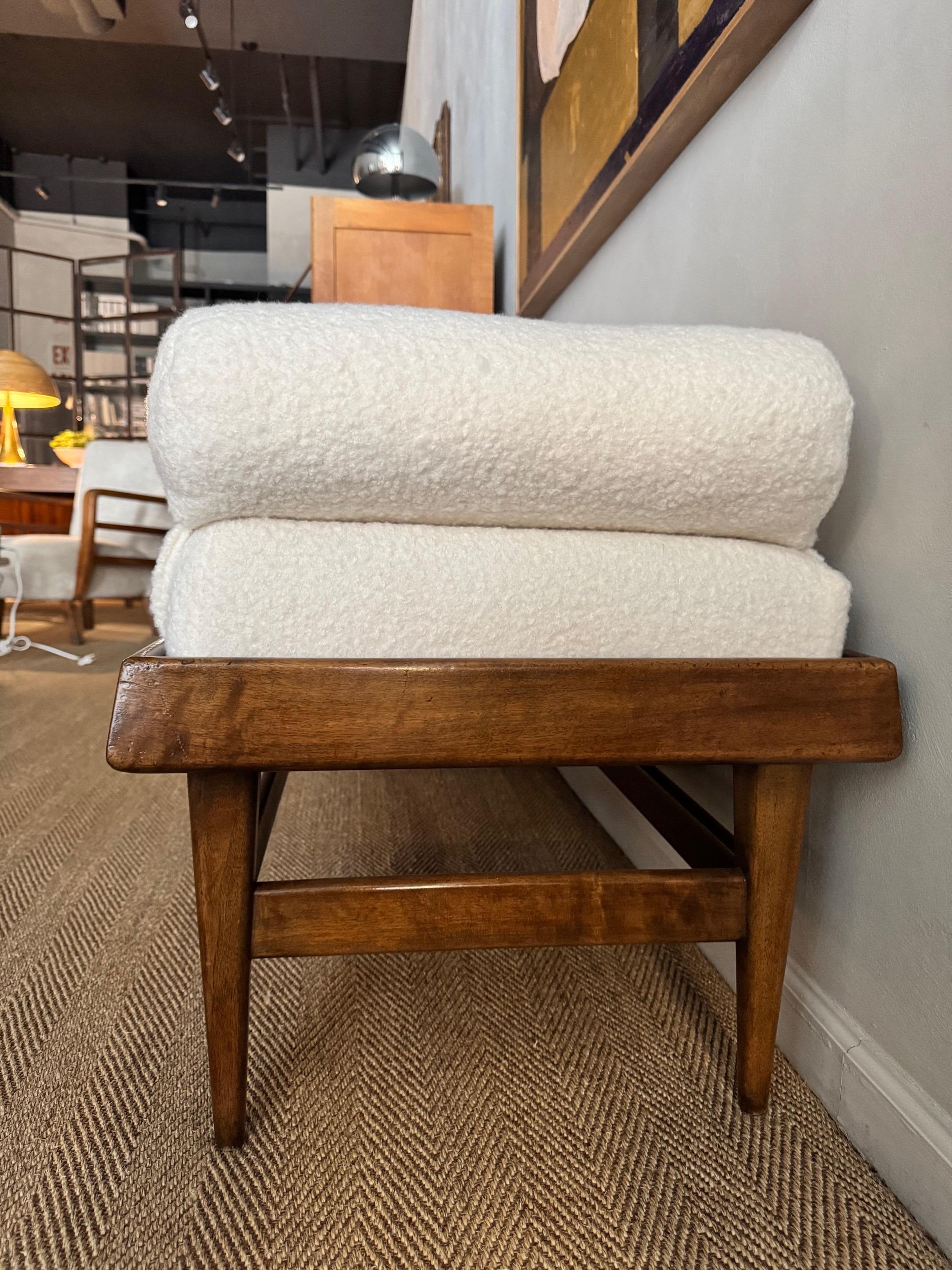 Beautiful Mahogany mid-century daybed upolstered in an ivory bouclé fabric