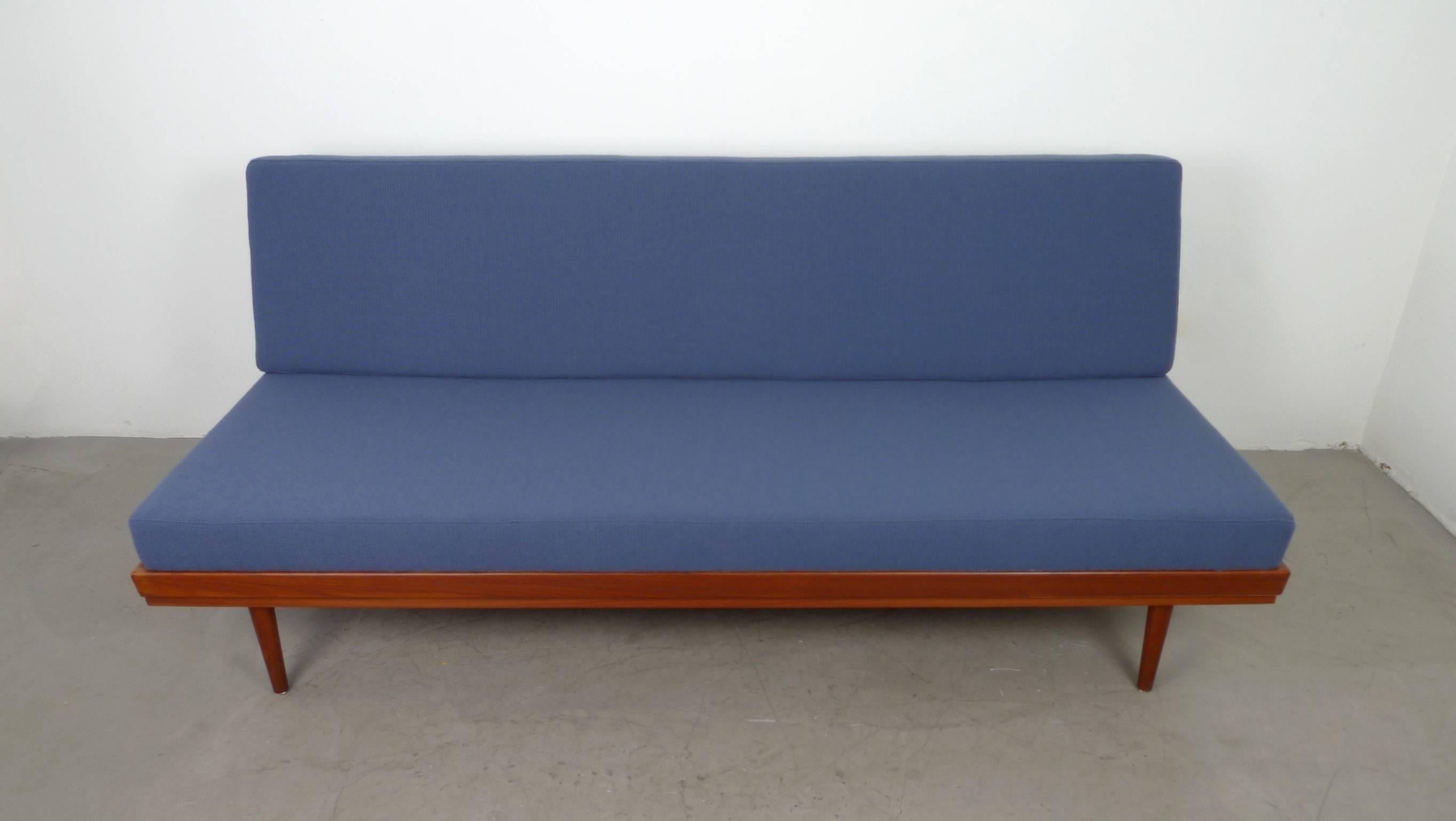 German manufacturer Walter Knoll designed and produced this sofabed in the 1950s. The frame is made of teak and the backrest has metal hinges that allow you to adjust the piece into a bed. To sleep or relax, the back pad can be removed and the back