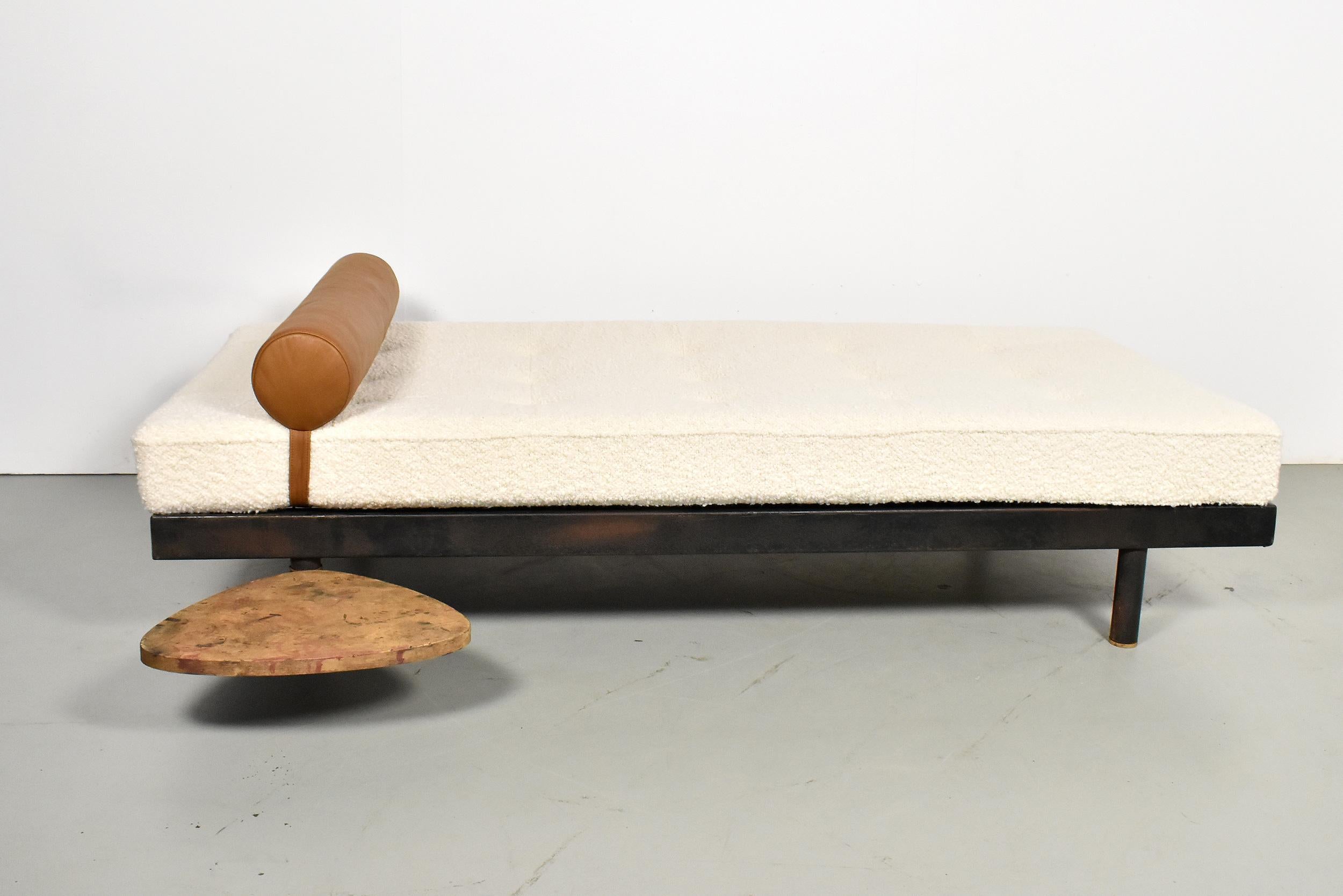 Daybed model S.C.A.L. Bed designed by Jean Prouvé from Atelier Prouve, Circa 1958. Structure in black painted bent sheet steel. The daybed has been fully restored with a new mattress completely re-upholstered in boucle fabric. The headrest has been