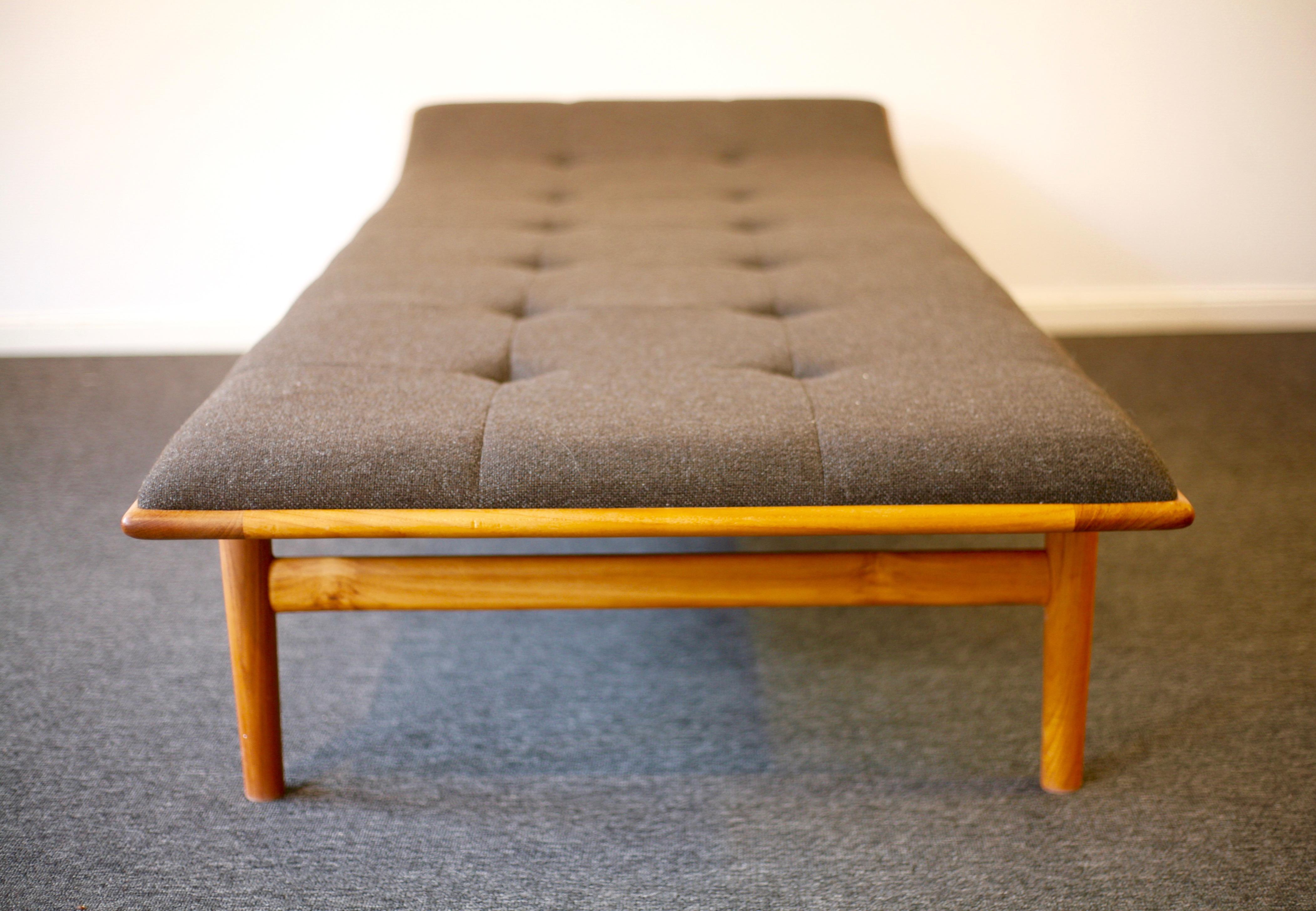Daybed in solid teak, model no 311, designed by Kurt Östervig for Jason in 1953. Brown upholstery by Kvadrat, Hallingdahl 65 designed by Nanna Ditzel. Matress fastened to daybed to avoid sliding. Exquisite design and handcraft.