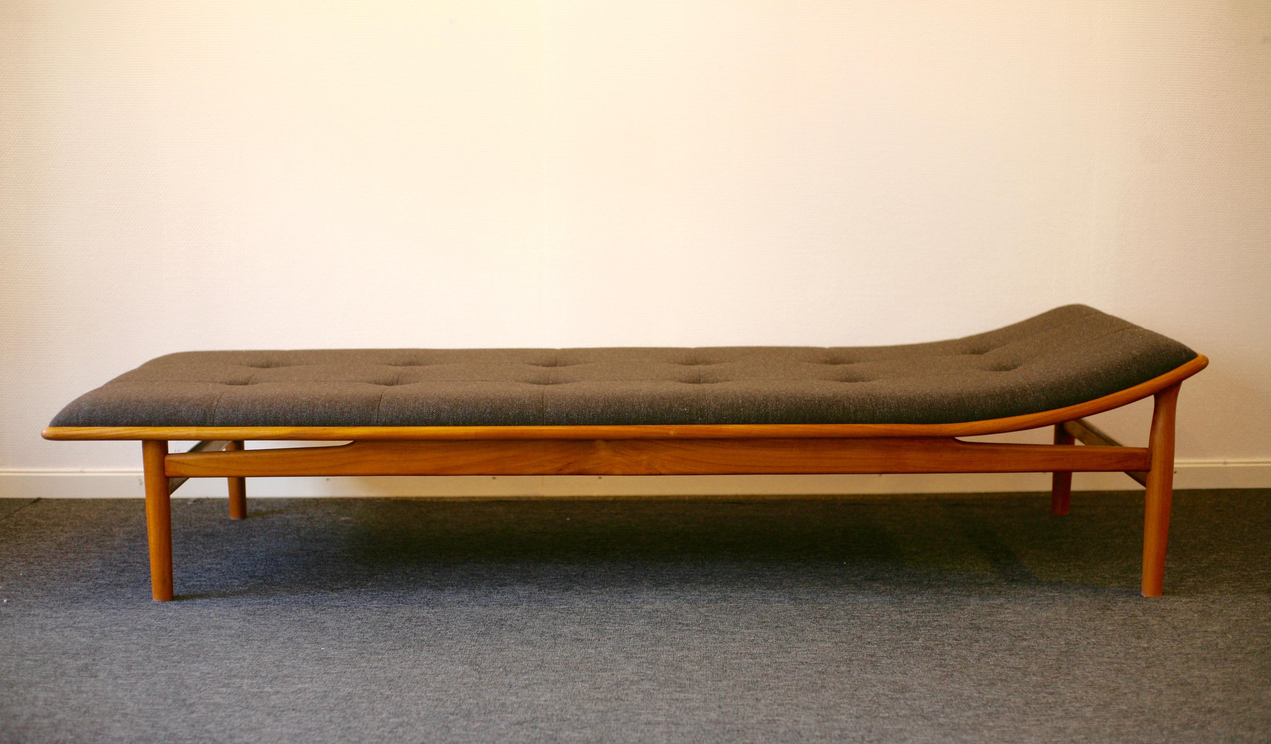 Daybed in solid teak, model no 311, designed by Kurt Östervig for Jason in 1953. Brown upholstery by Kvadrat, Hallingdahl 65 designed by Nanna Ditzel. Matress fastened to daybed to avoid sliding. Exquisite design and handcraft. Newly made under