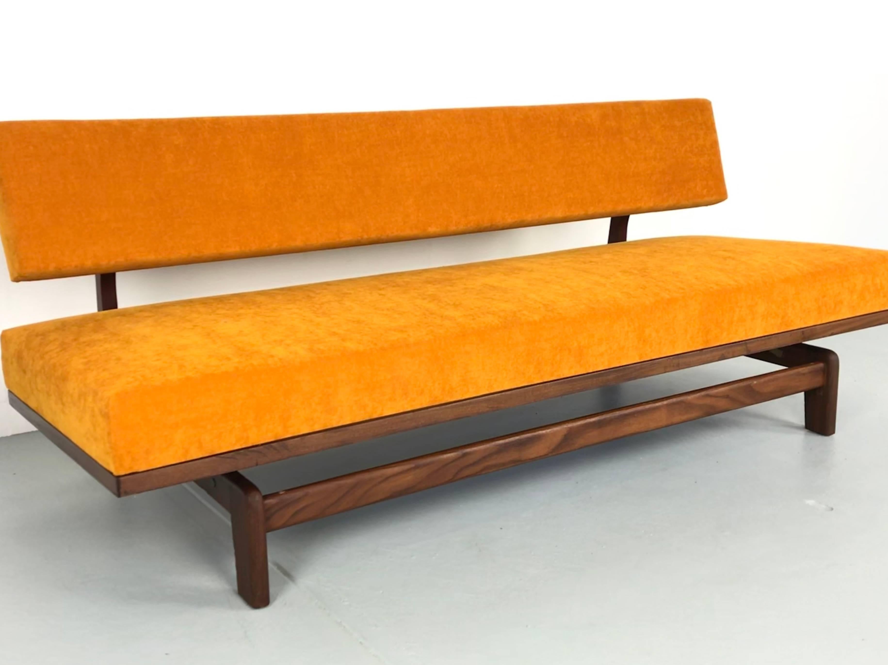 High quality teak wood sofa by Hans Bellmann, produced by Wilkhahn in Germany. The sofa can be used as a daybed. The cushions have been reupholstered with a golden yellow velvet fabric. Great condition with slight signs of use on the wood frame.