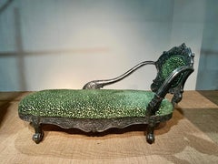 Daybed with silver plated carved wood decor on the backrest