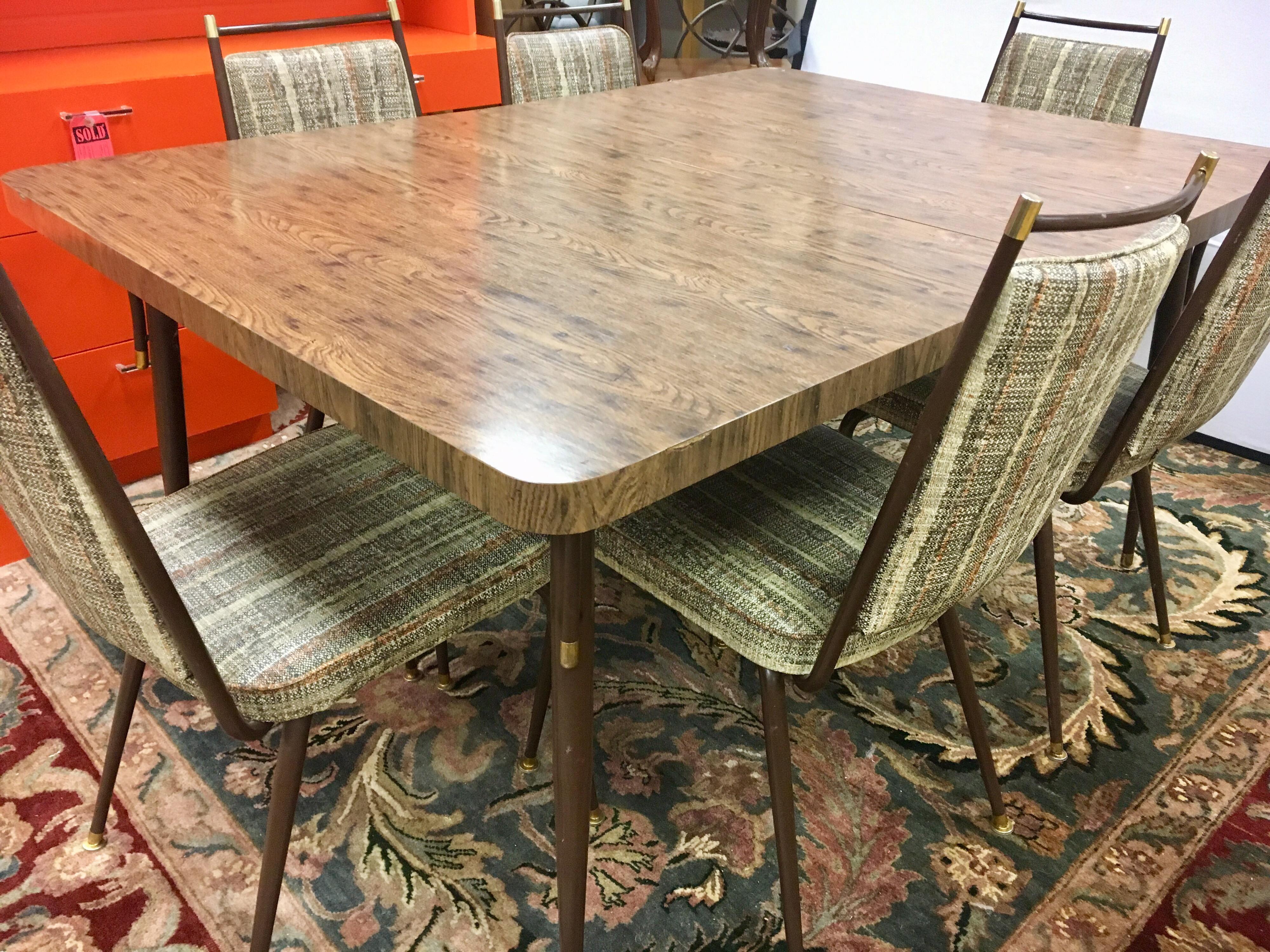 Iconic Daystrom furniture 1974 set dining room or kitchen set which includes matching table and seven chairs. The table is sixty inches long as shown but also comes with one ten inch leaf to expand table to seventy inches. There are a total of seven