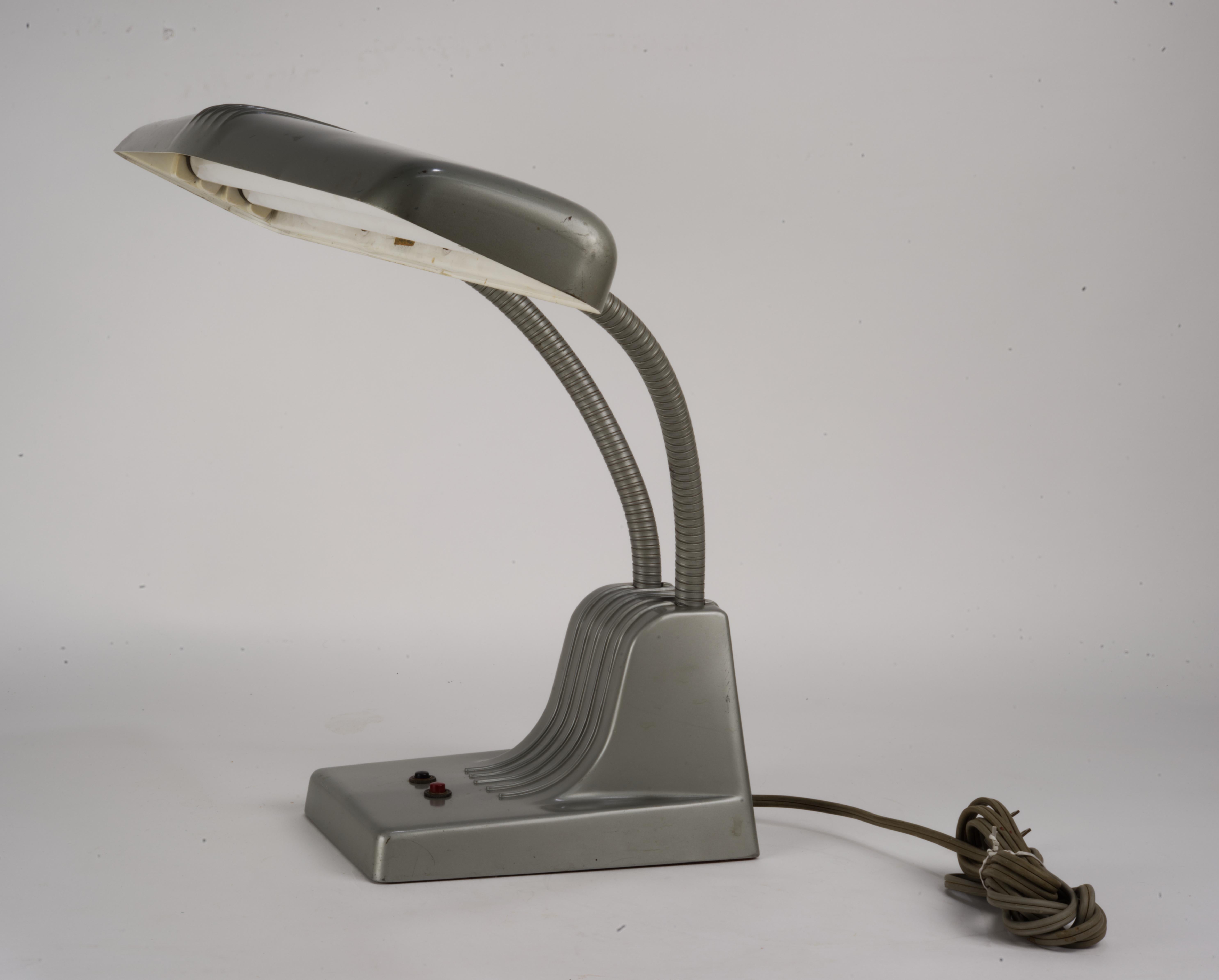 Classic Industrial Dazor 1000 design. 
Highly adjustable shell. Double flourecent 15watt bulbs (available from many hardware stores or online) 
Paint has a few scuffs but not terrible. Lamp works well and hasn't been rewired. 
