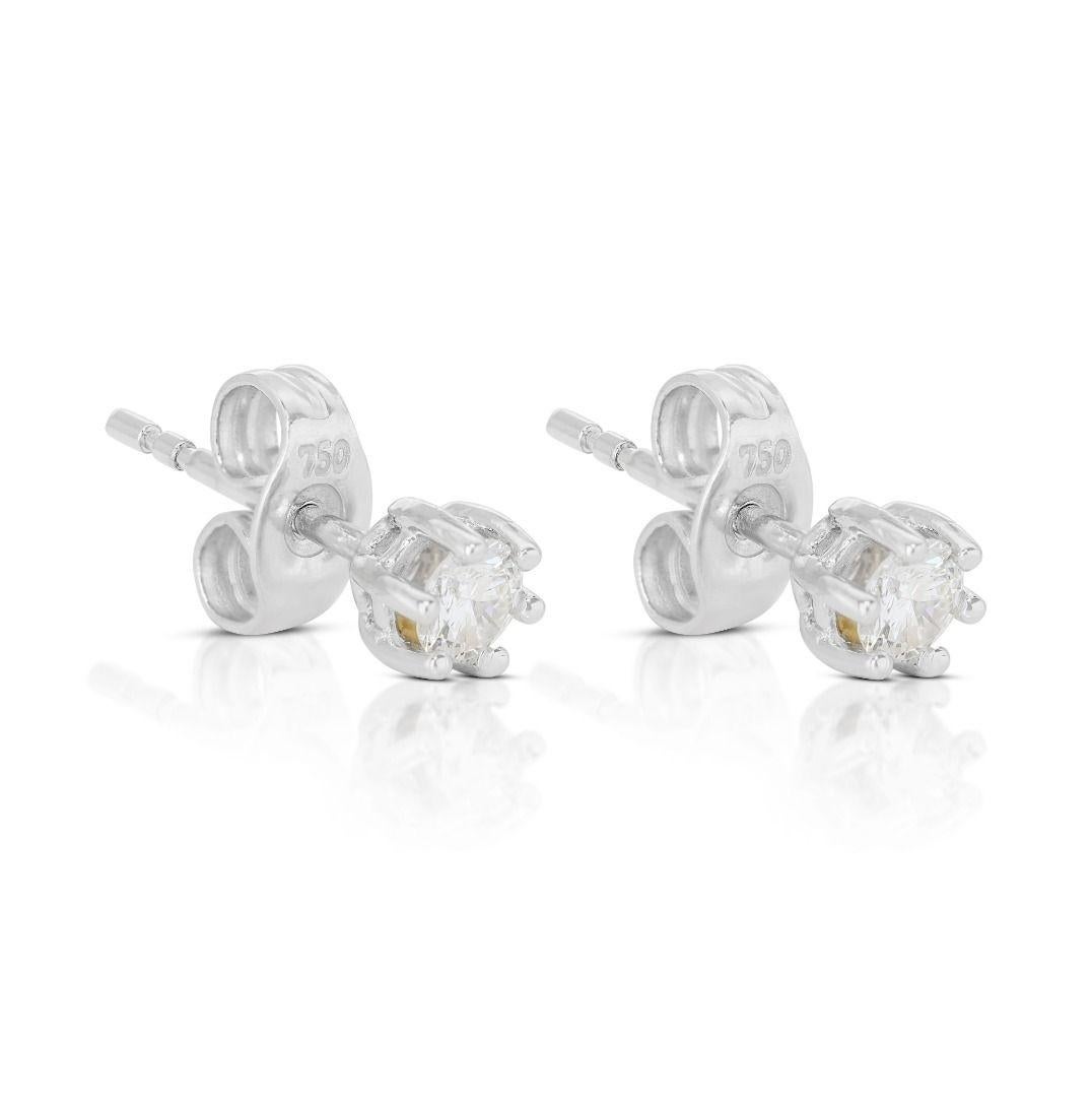 Round Cut Dazzling 0.14ct Solitaire Diamond Stud Earrings set in 18K White Gold For Sale