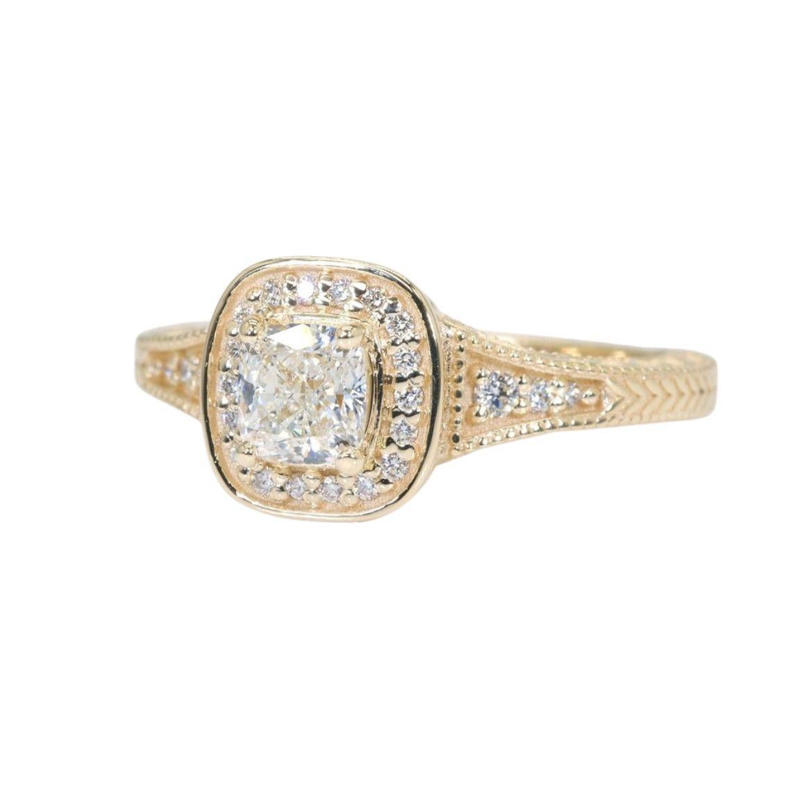 Embrace captivating fire and sophisticated charm with this breathtaking cushion modified brilliant diamond ring, showcasing a dazzling 0.7 carat center stone that radiates brilliance and timeless elegance. Crafted in gleaming 18K yellow gold, this