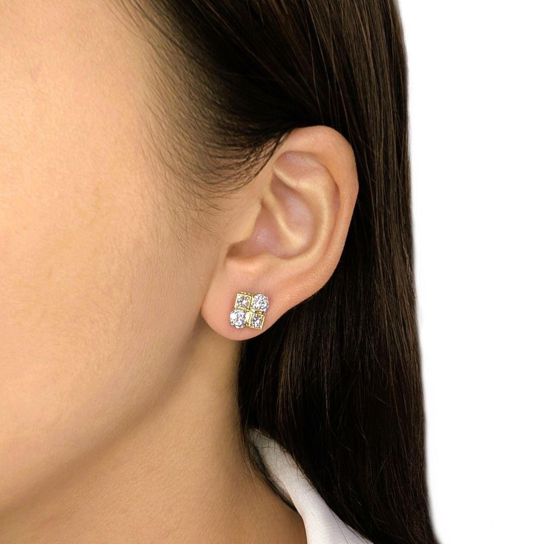 A bold yet refined design, these earrings showcase four princess-cut natural diamonds totaling 0.60ct, their sharp facets radiating brilliance with every movement. Complementing them are 12 round brilliant-cut natural diamonds (0.18ct total, G