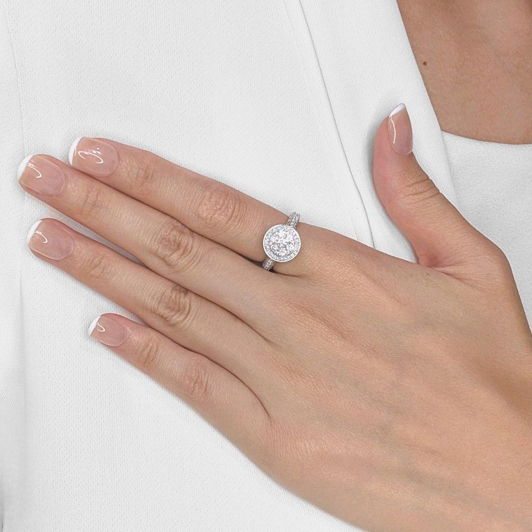 Imagine a breathtaking display of brilliance, where every angle catches the light in a symphony of sparkle. This new 18K white gold ring features seven magnificent round brilliant diamonds, totaling 0.69ct, boasting G-H color and VS-SI clarity,