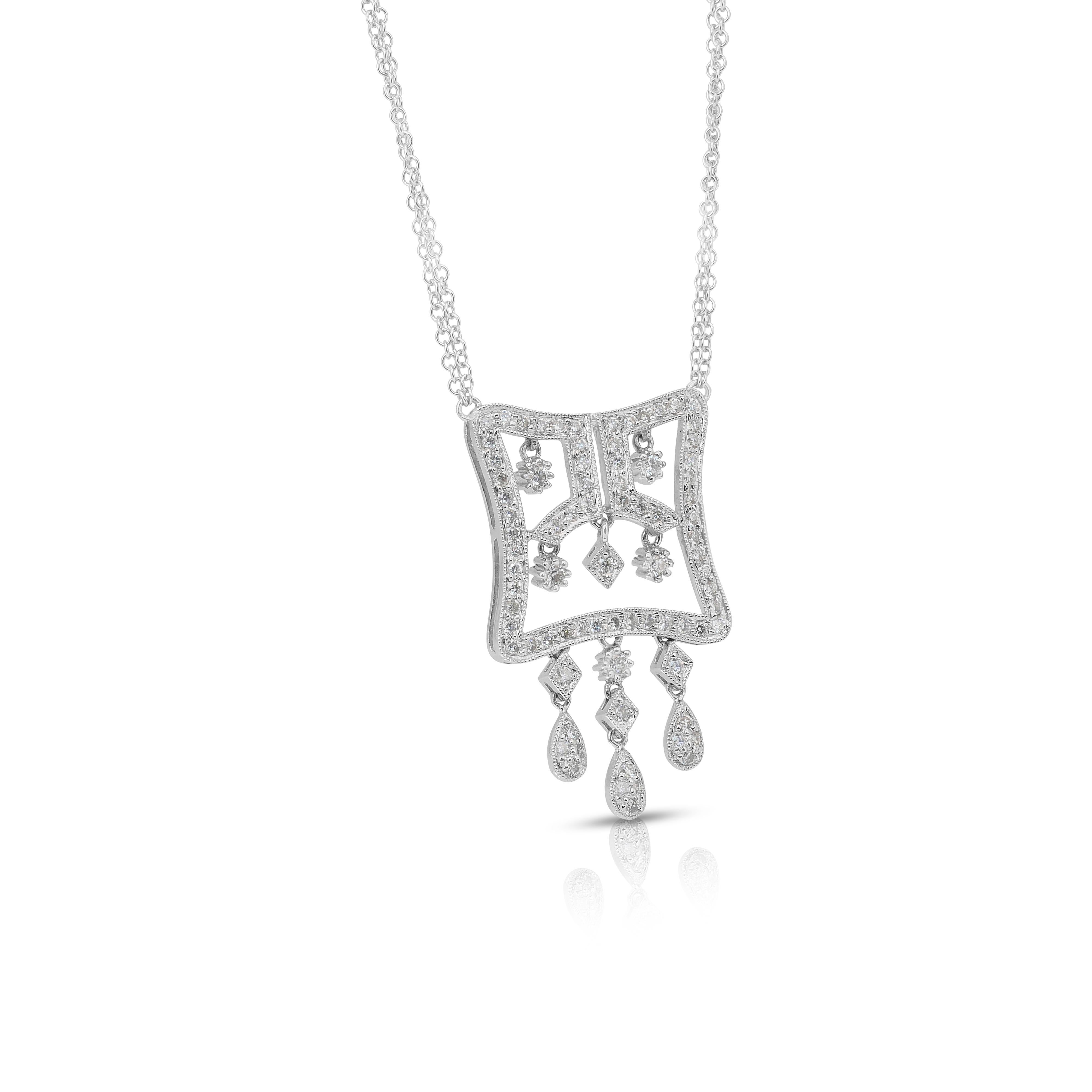 Collier éblouissant de 1,03ct de diamants en or blanc 18k - certifié IGI

L'élégance discrète rencontre l'éclat raffiné dans ce collier en or blanc 18 carats, orné de 80 diamants de taille ronde d'une valeur totale de 1,03 carat. Chaque diamant est