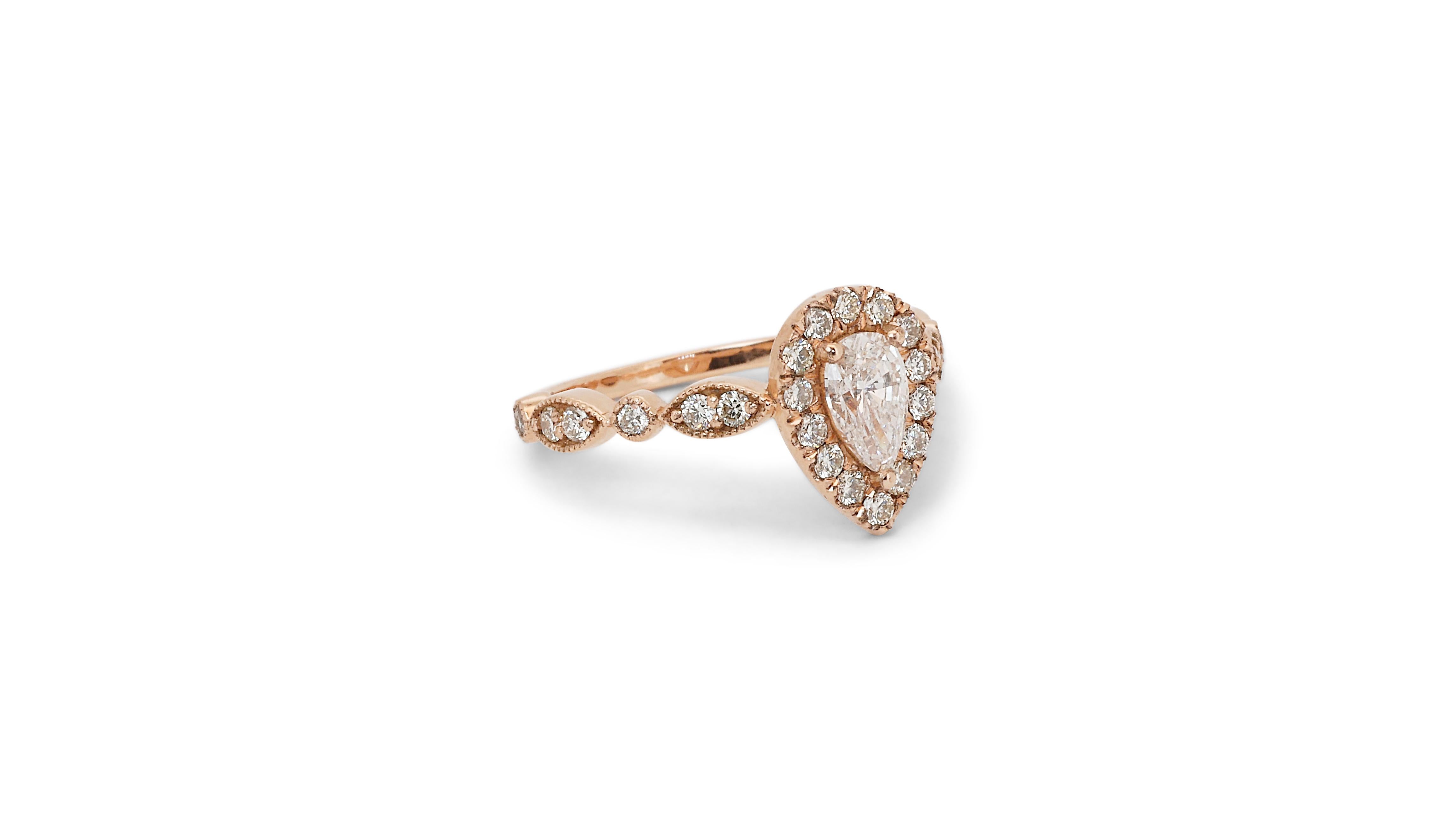 Dazzling 1.21ct Double Excellent Ideal Cut Diamond Halo Ring - GIA Certified

Adorn yourself with this exquisite halo ring featuring a 0.76-carat pear-shaped diamond, set in luxurious 18k rose gold. With a double excellent ideal cut, this diamond