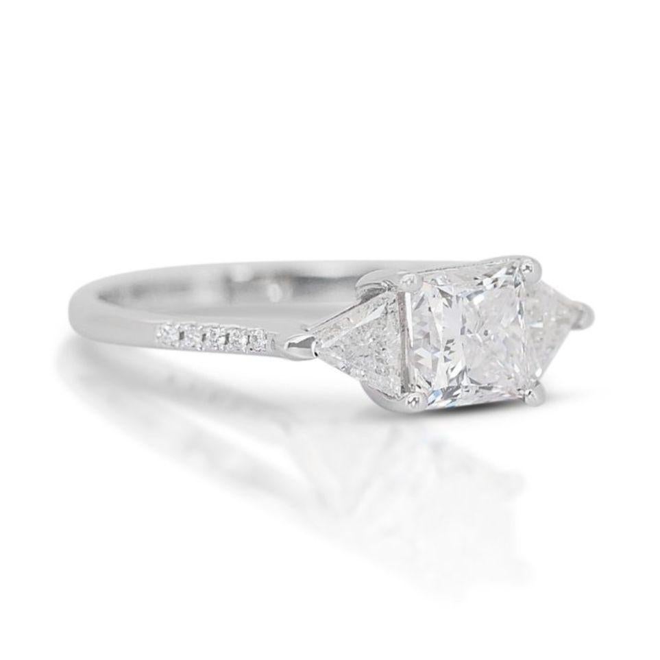 This ring is more than just an accessory; it's a statement piece that embodies modern elegance and timeless sparkle. The princess cut diamond makes a bold statement, while the triangle side stones add a touch of individuality. Whether you're